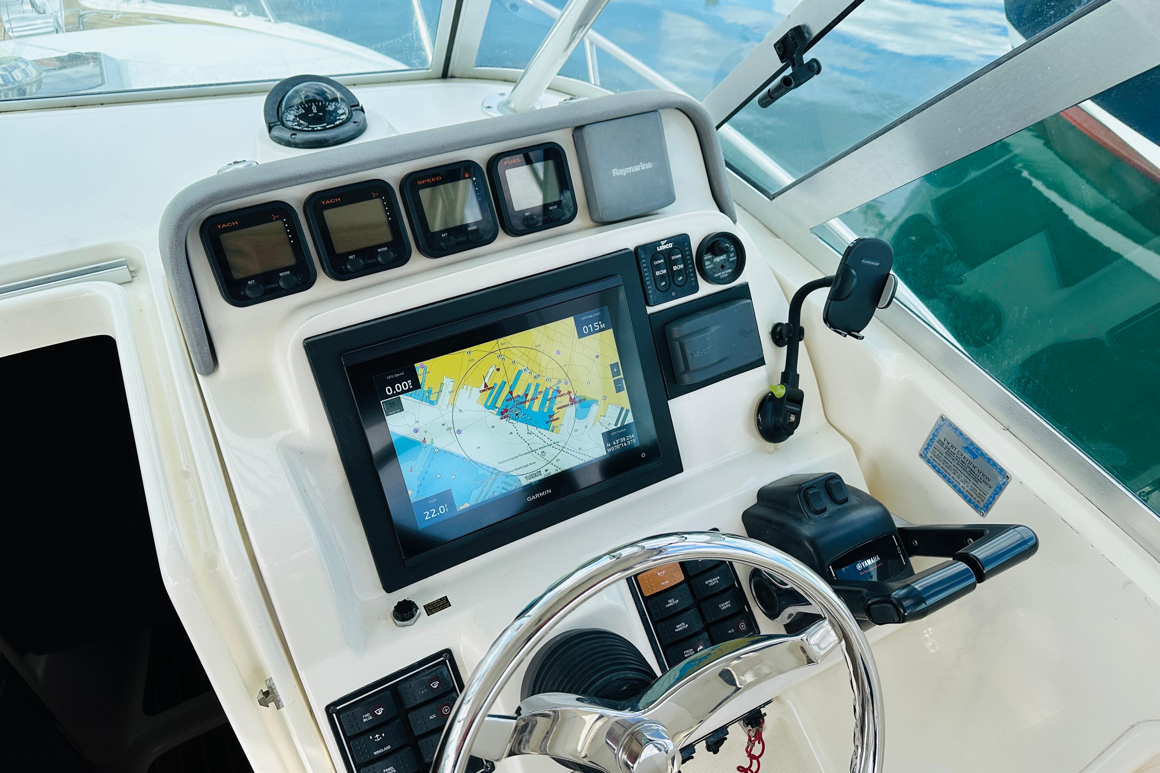 2007 Pursuit OS 285 Offshore boat dashboard with navigation system and controls.