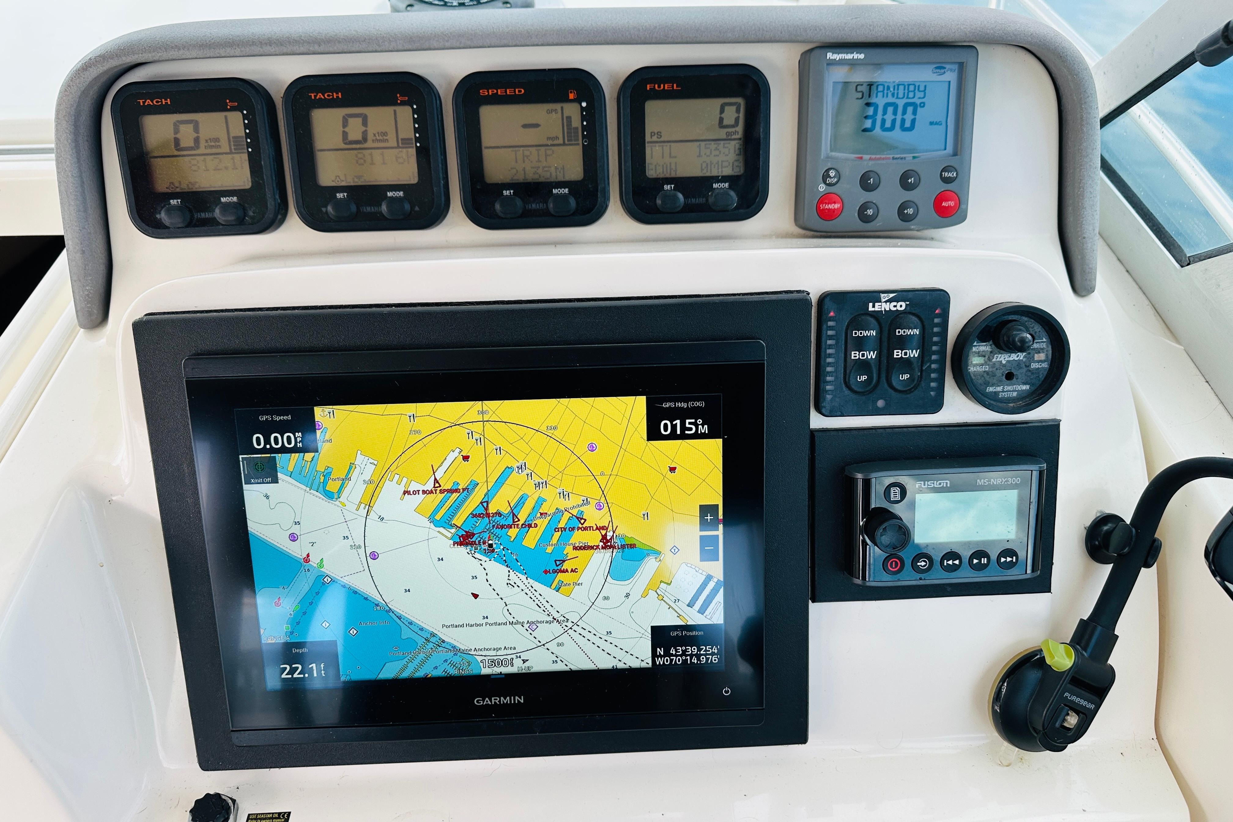 Dashboard of a 2007 Pursuit OS 285 Offshore boat with navigation and control instruments.