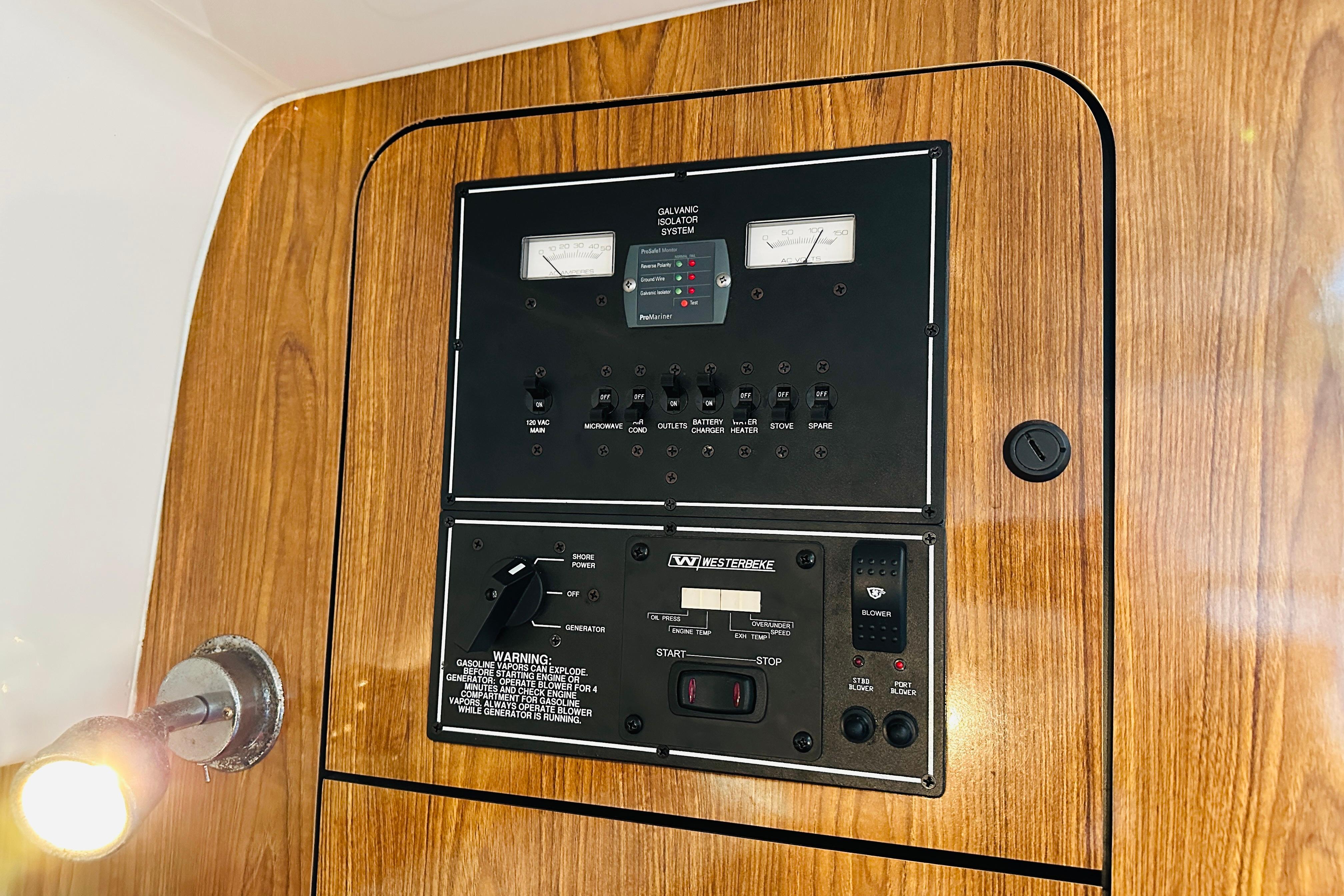 Control panel of a 2007 Pursuit OS 285 Offshore boat, featuring gauges and switches.