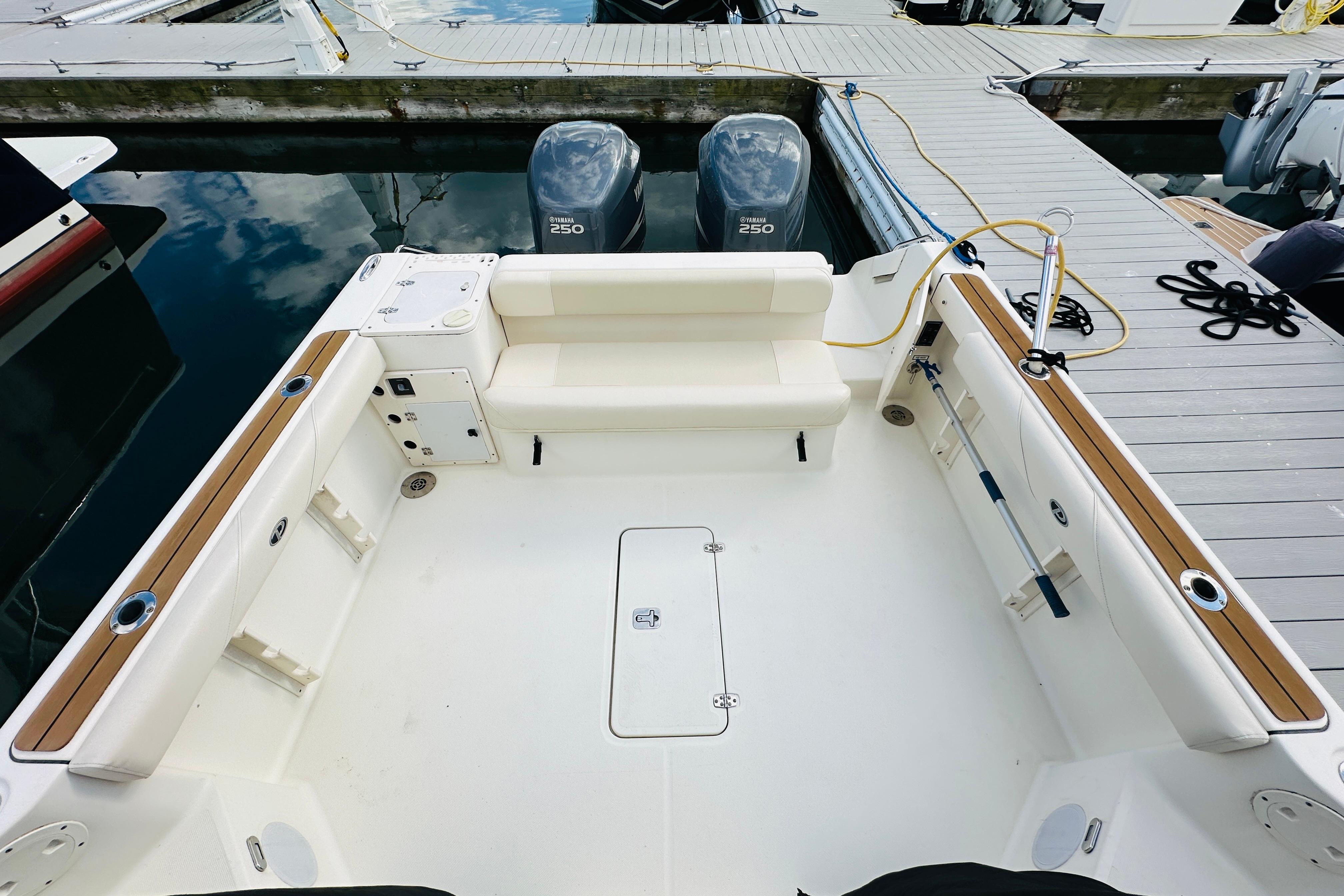 2007 Pursuit OS 285 Offshore boat interior with seating and twin Yamaha 250 engines.