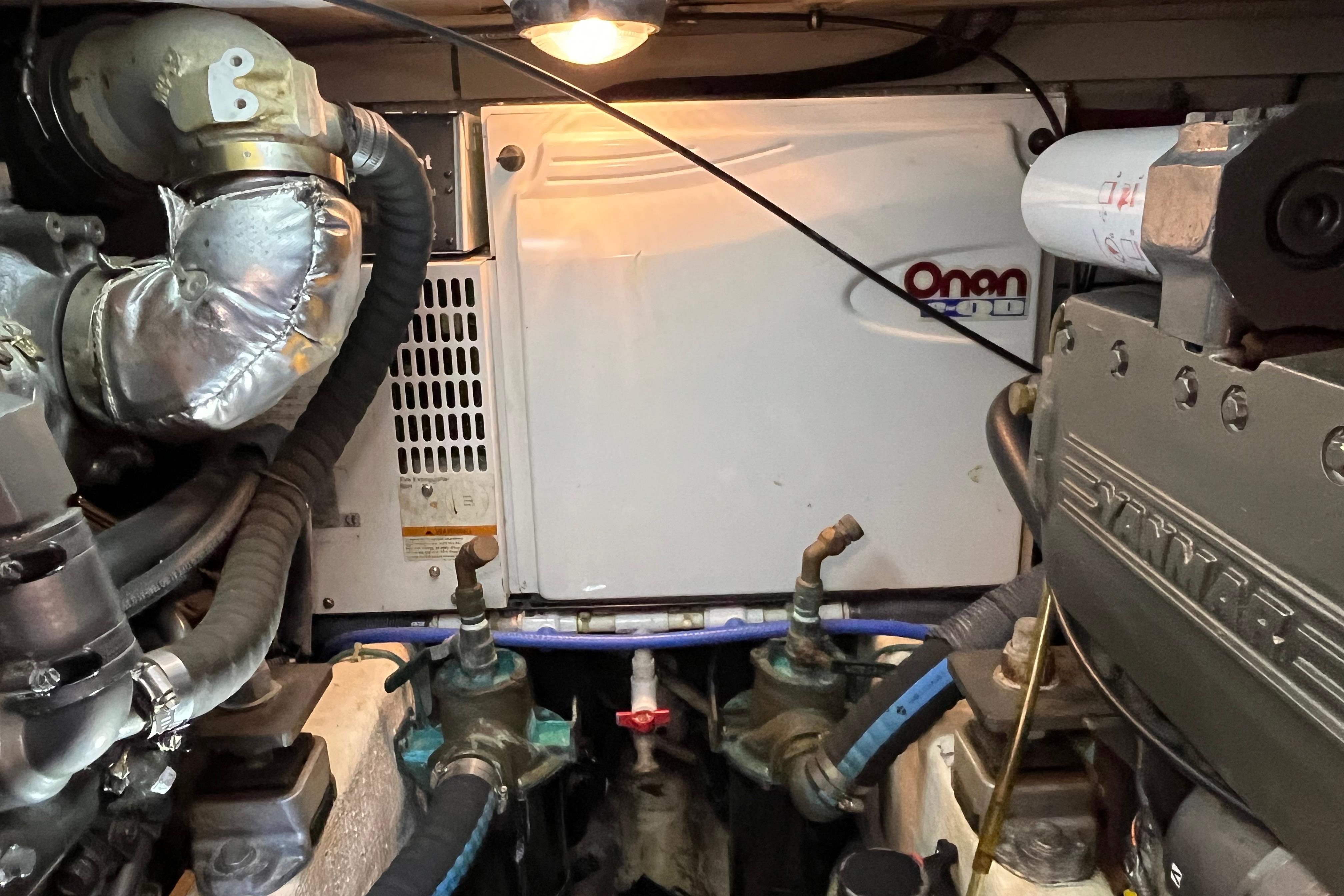 Engine room of 2006 Sabre 36 Flybridge Sedan with Onan generator and Yanmar engine.