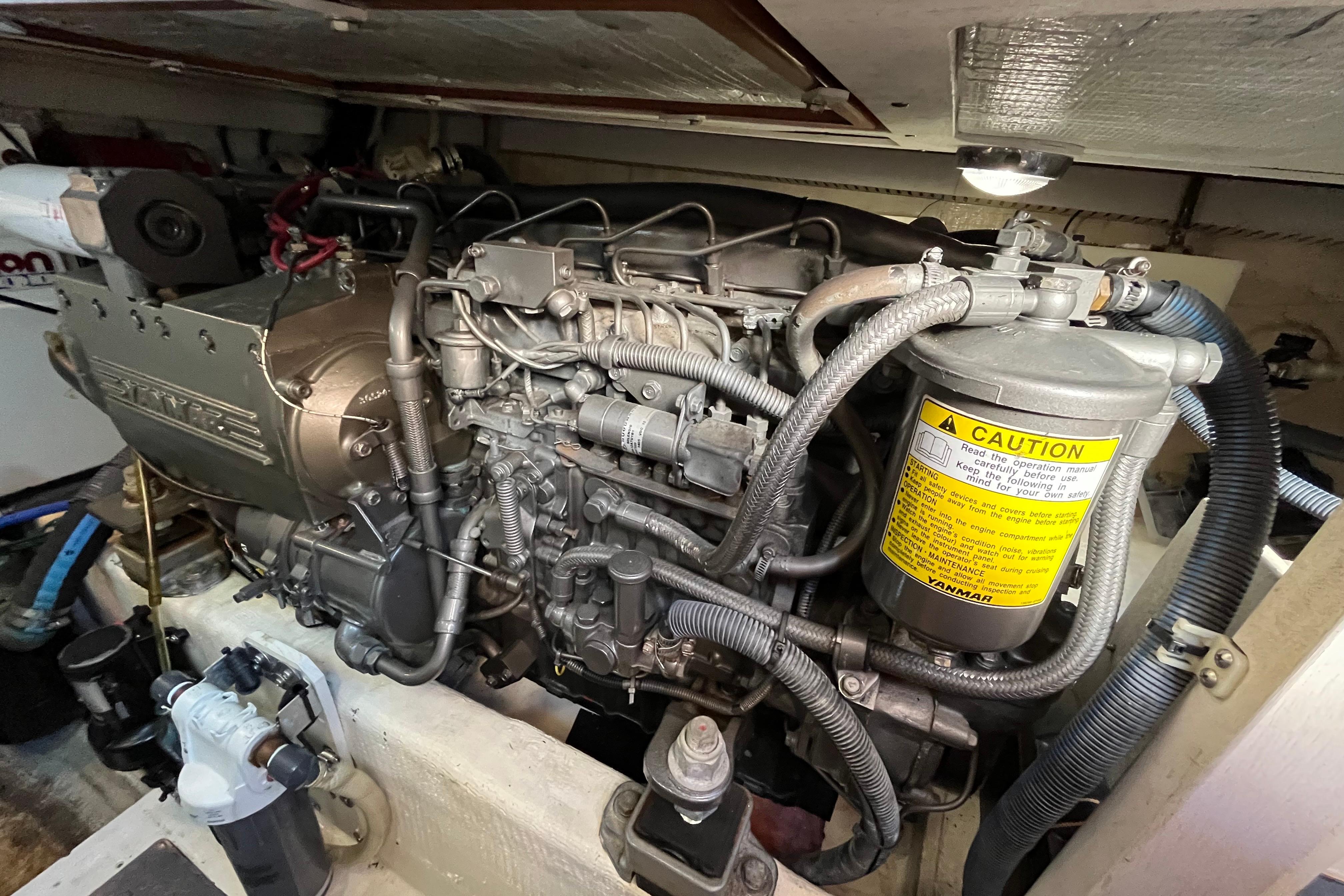 Engine compartment of 2006 Sabre 36 Flybridge Sedan, showcasing detailed mechanical components.