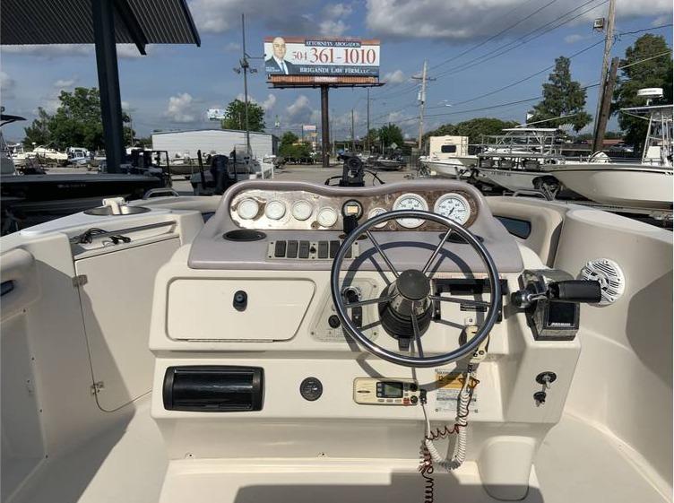 1997 Regal 200 DESTINY boat dashboard with steering wheel and gauges.