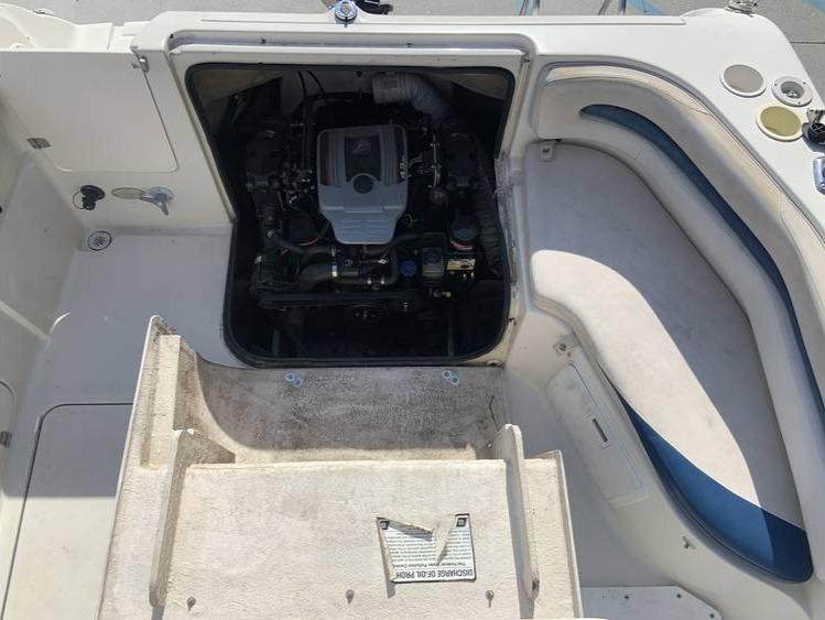 1997 Regal 200 DESTINY boat engine compartment with seating area.