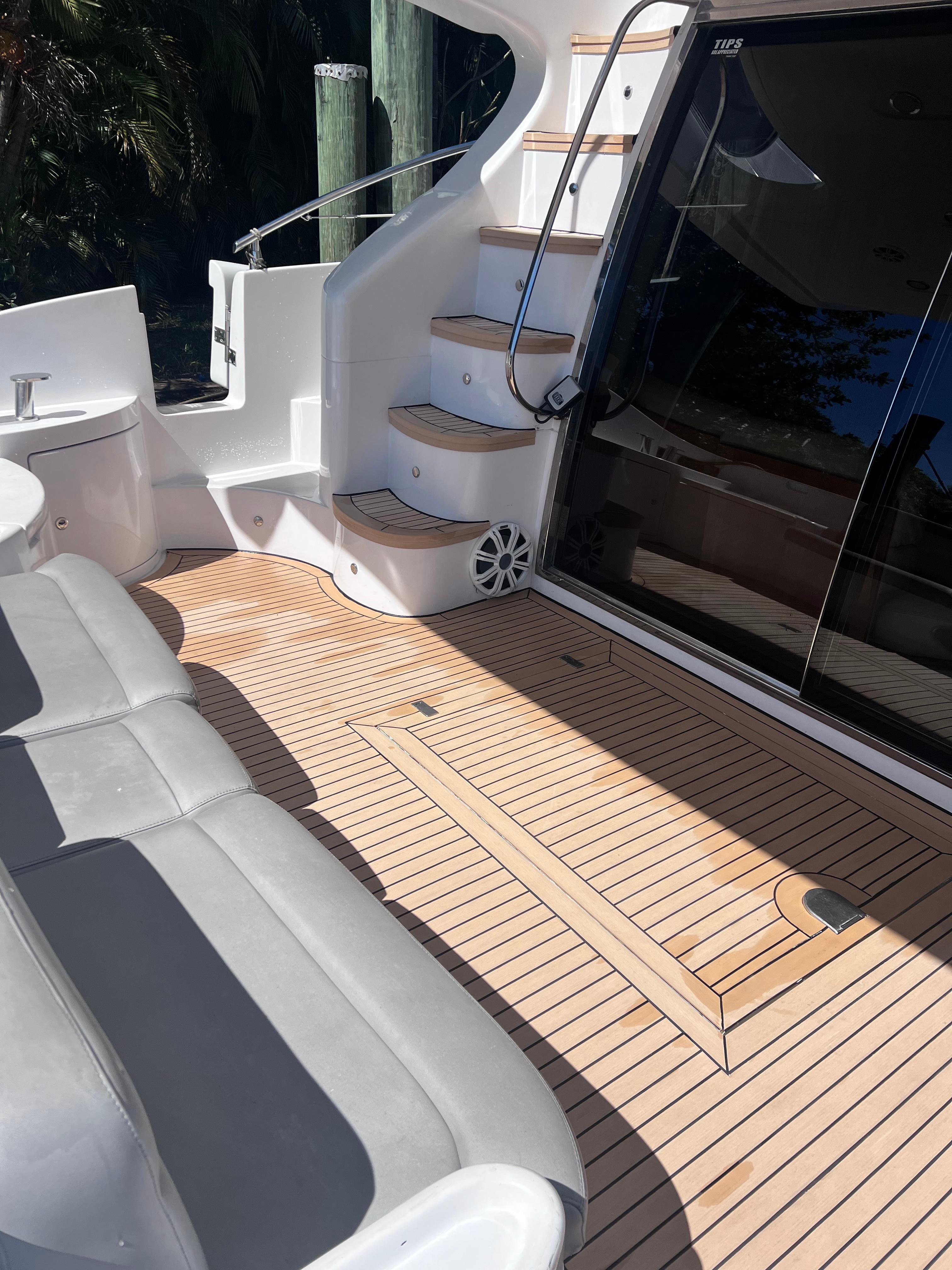 Azimut-55 flybridge 2005-Susi FL-US-Azimut 55 Flybridge 2005 yacht deck with seating and stairs, featuring sleek design and wood finish.-9213395 | Thumbnail