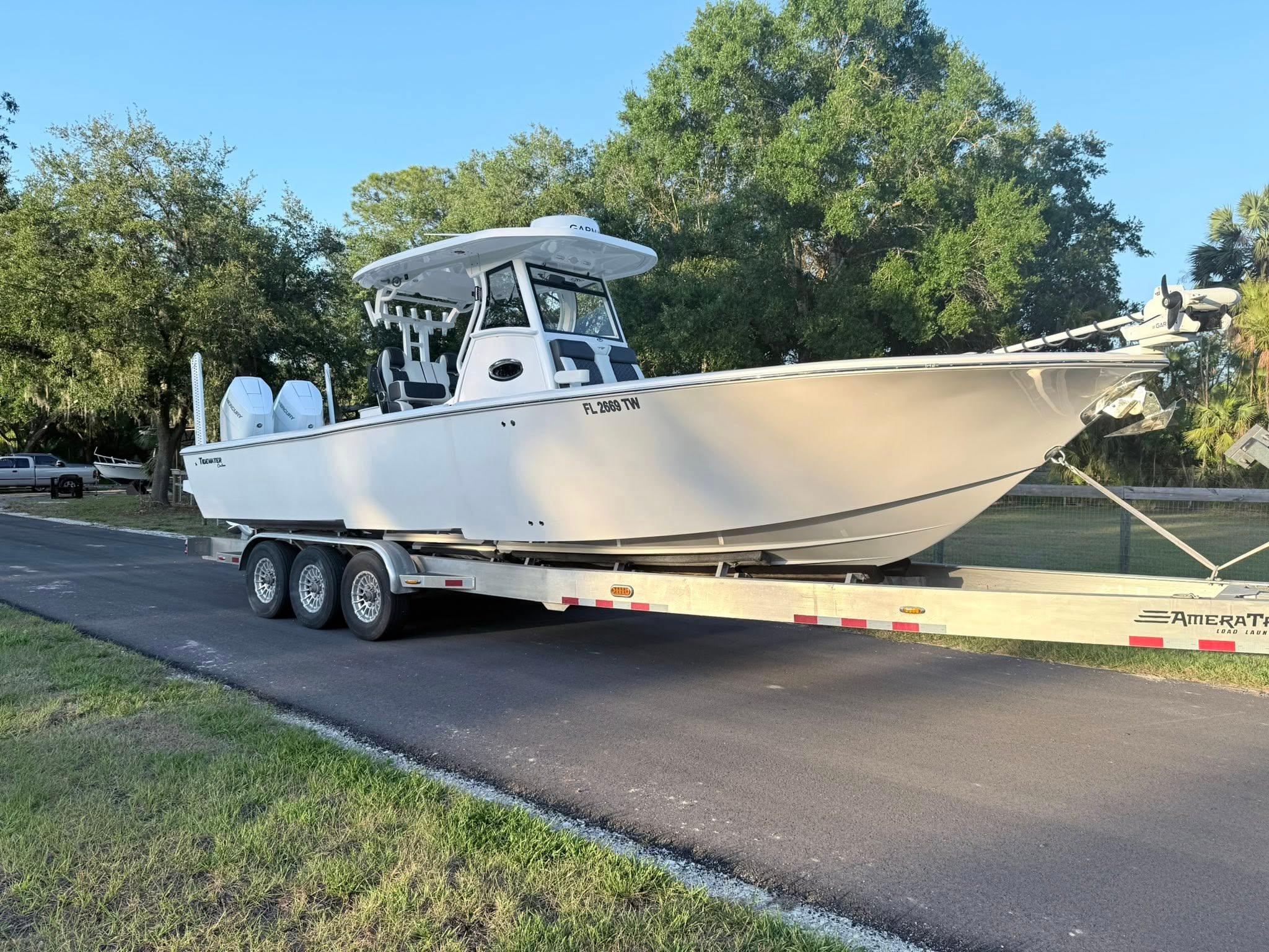 Tidewater-3100 Carolina Bay 2025 -FL-US-2025 Tidewater 3100 Carolina Bay boat on trailer, parked on a road.-9803417