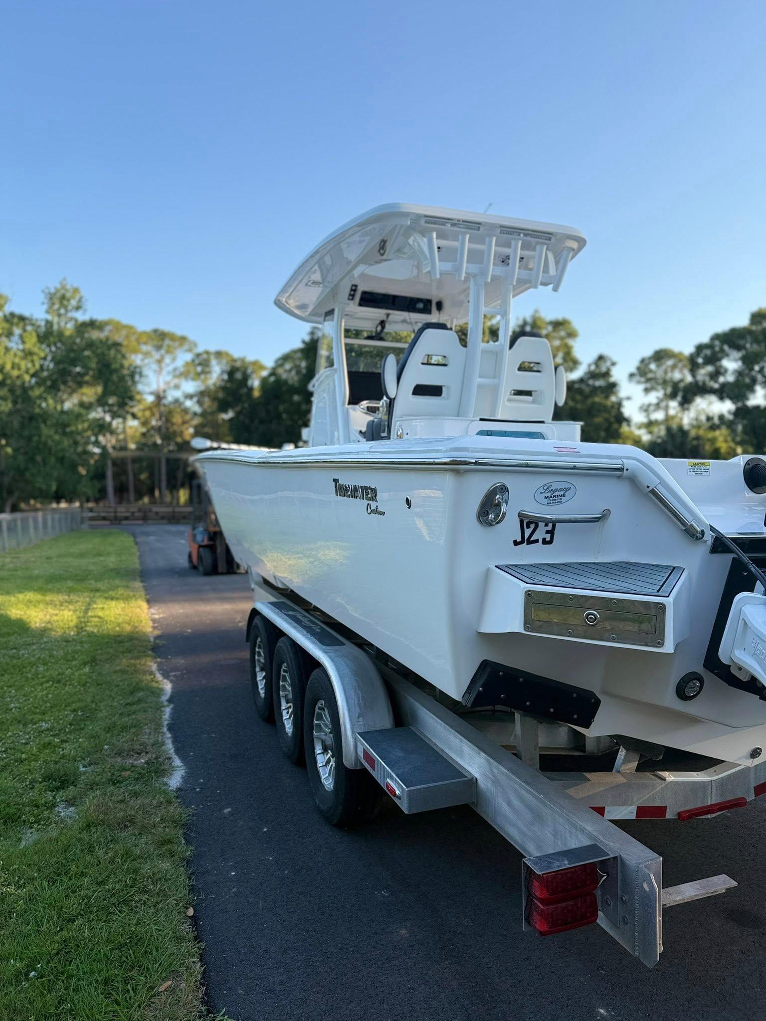 Tidewater-3100 Carolina Bay 2025 -FL-US-2025 Tidewater 3100 Carolina Bay boat on trailer, parked outdoors.-9803417 | Thumbnail