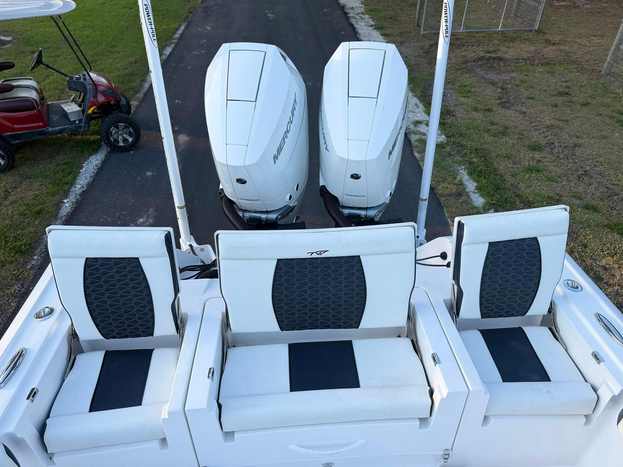 Tidewater-3100 Carolina Bay 2025 -FL-US-2025 Tidewater 3100 Carolina Bay boat with triple Mercury engines and cushioned seating.-9803417 | Thumbnail