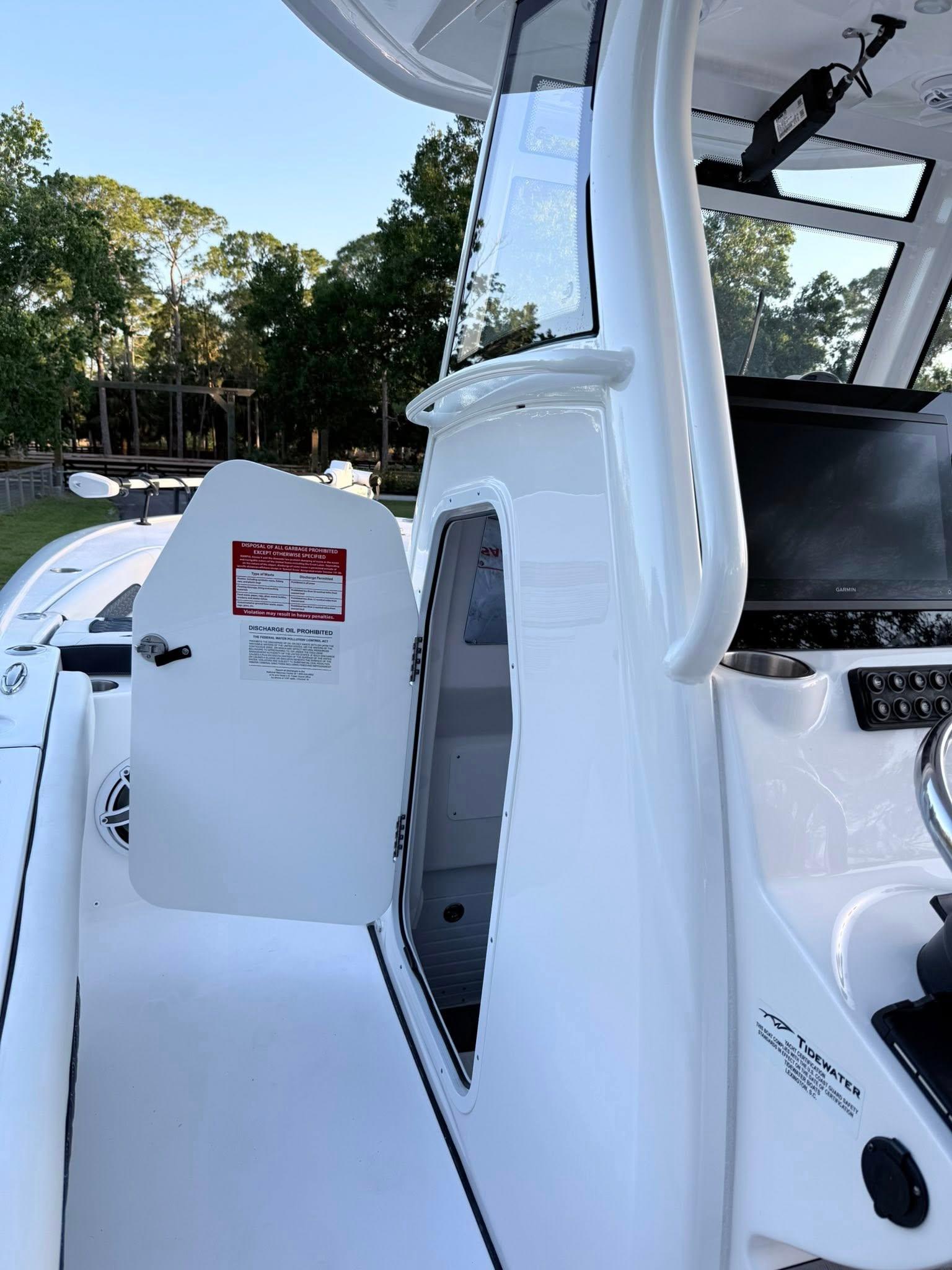 Tidewater-3100 Carolina Bay 2025 -FL-US-2025 Tidewater 3100 Carolina Bay boat interior with open cabin door.-9803417 | Thumbnail