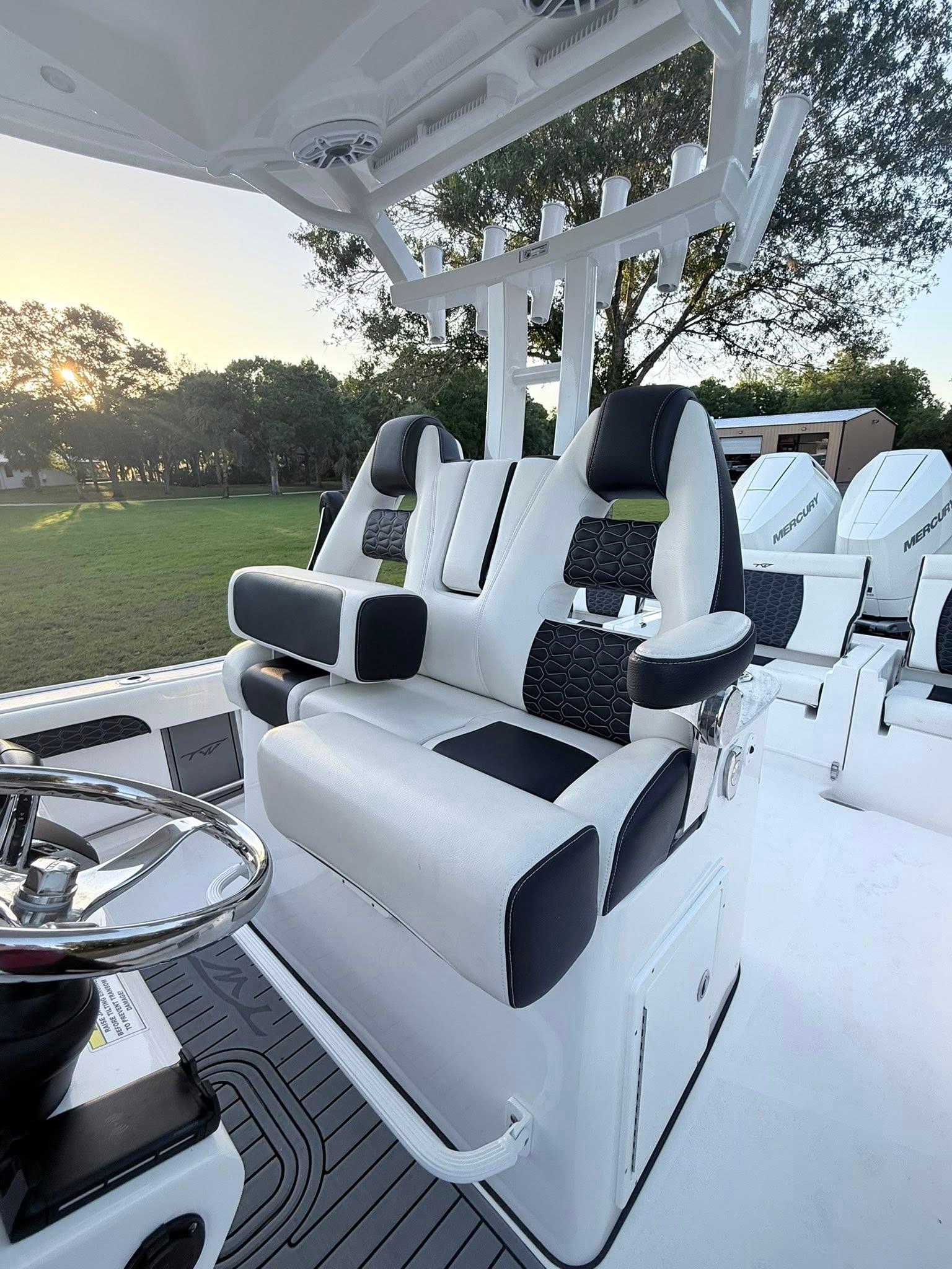 Tidewater-3100 Carolina Bay 2025 -FL-US-2025 Tidewater 3100 Carolina Bay boat interior with modern seating and steering wheel.-9803417 | Thumbnail
