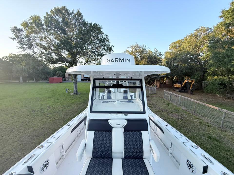 Tidewater-3100 Carolina Bay 2025 -FL-US-2025 Tidewater 3100 Carolina Bay boat with Garmin equipment, parked on grassy area.-9803417 | Thumbnail
