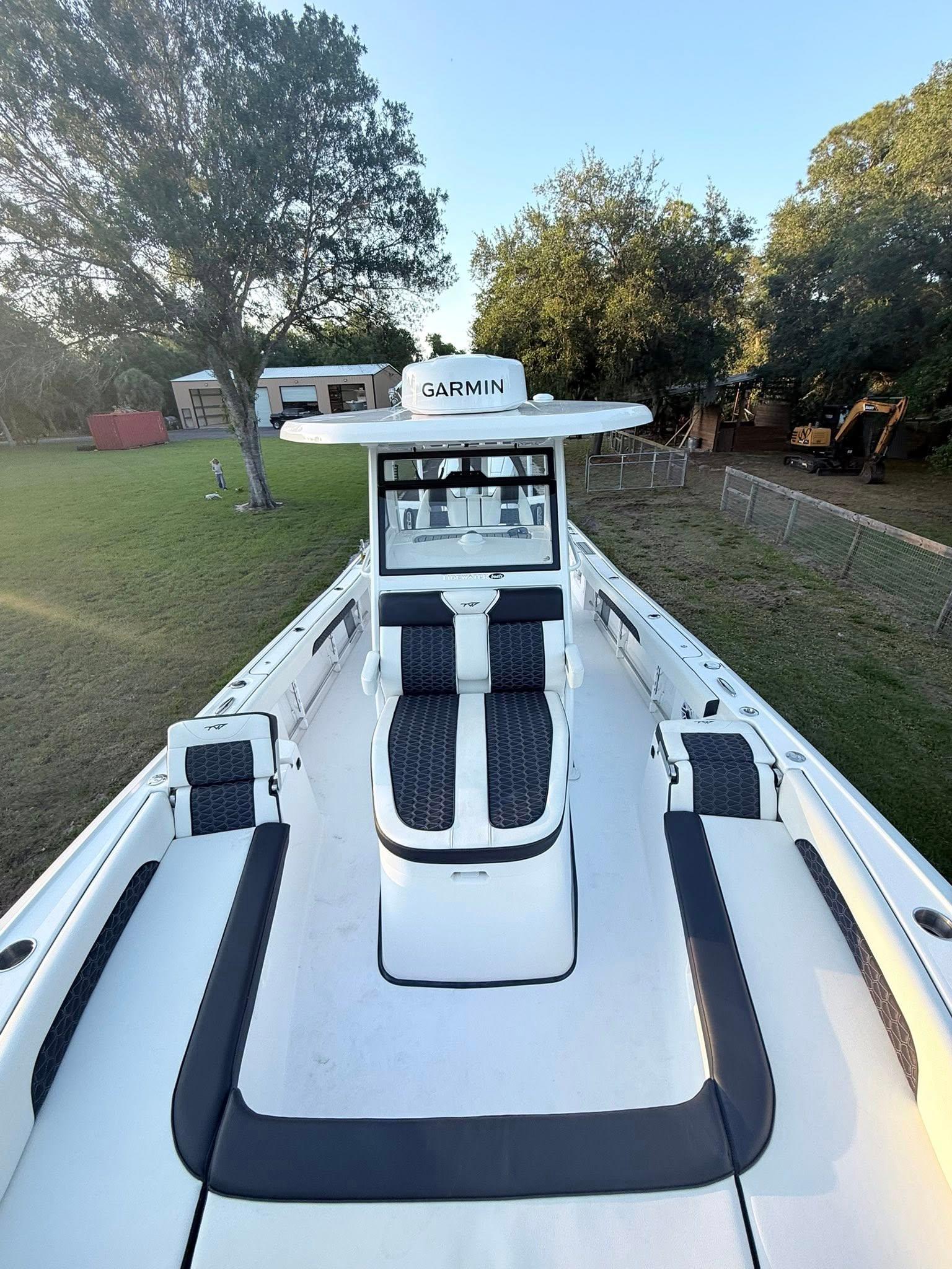 Tidewater-3100 Carolina Bay 2025 -FL-US-2025 Tidewater 3100 Carolina Bay boat with Garmin equipment, docked in a grassy area.-9803417 | Thumbnail