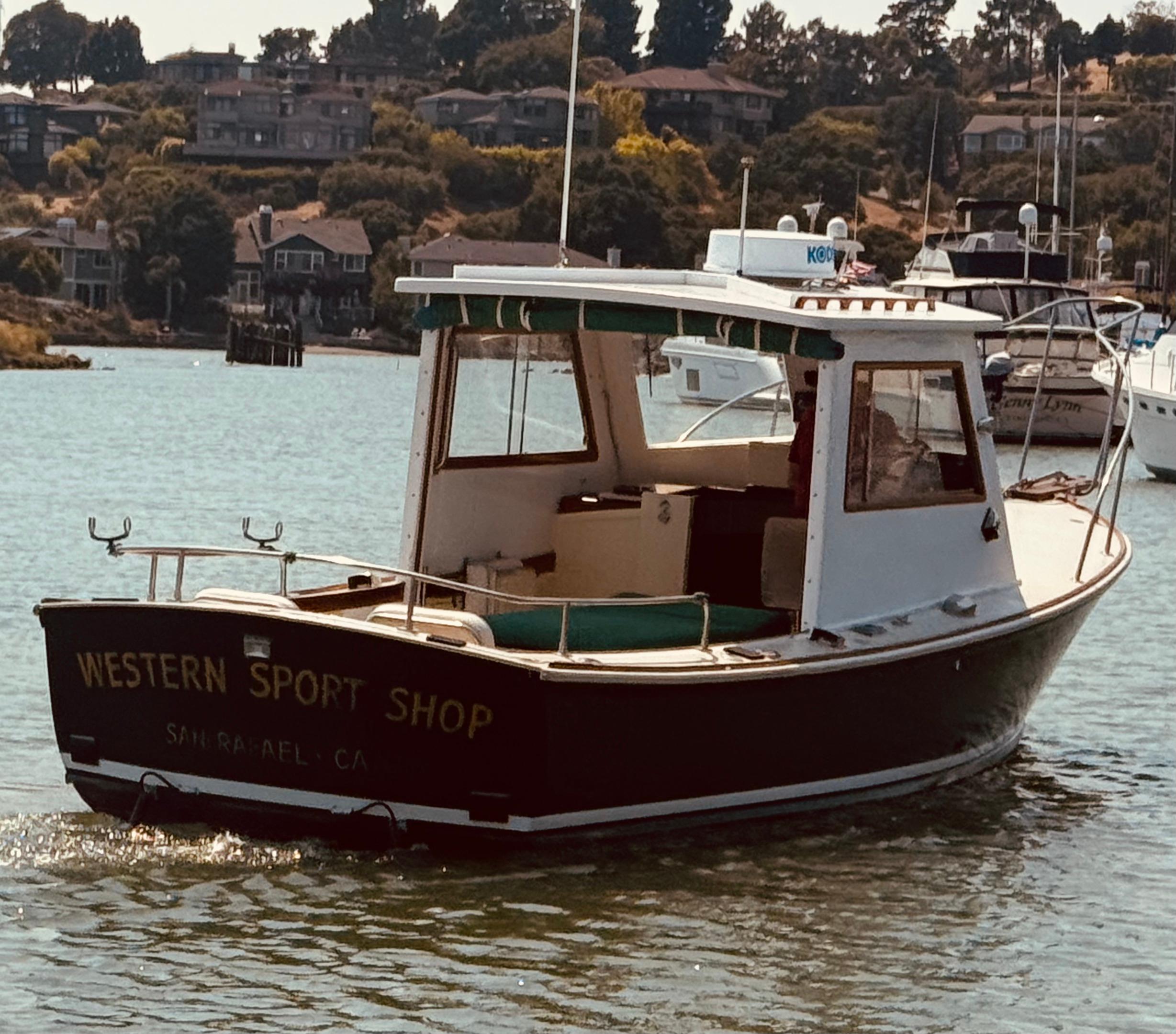 1974 Dyer 29' Sport Fisher boat on water, labeled "Western Sport Shop."
