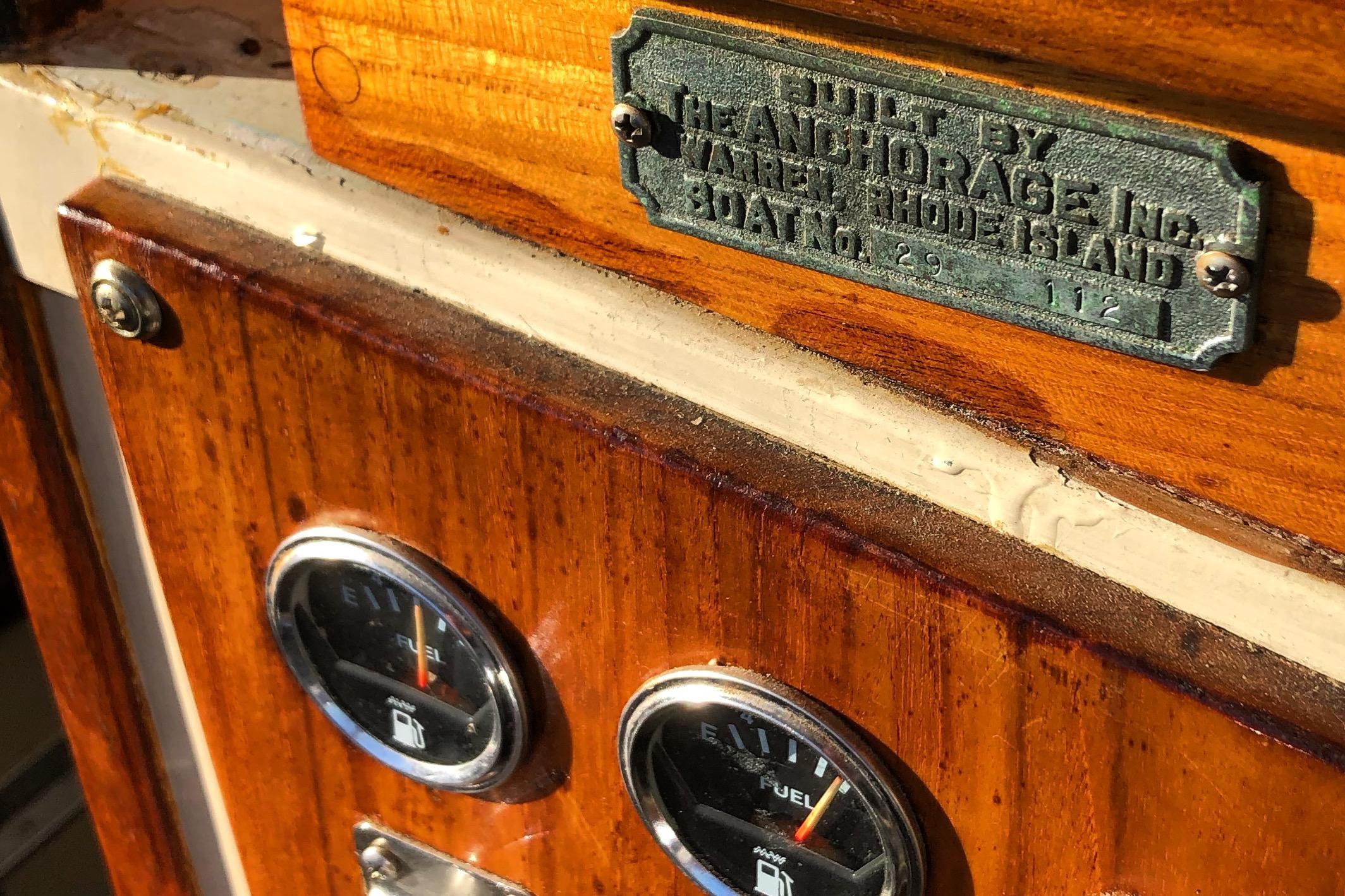 1974 Dyer 29' Sport Fisher boat dashboard with fuel gauges and builder's plaque.