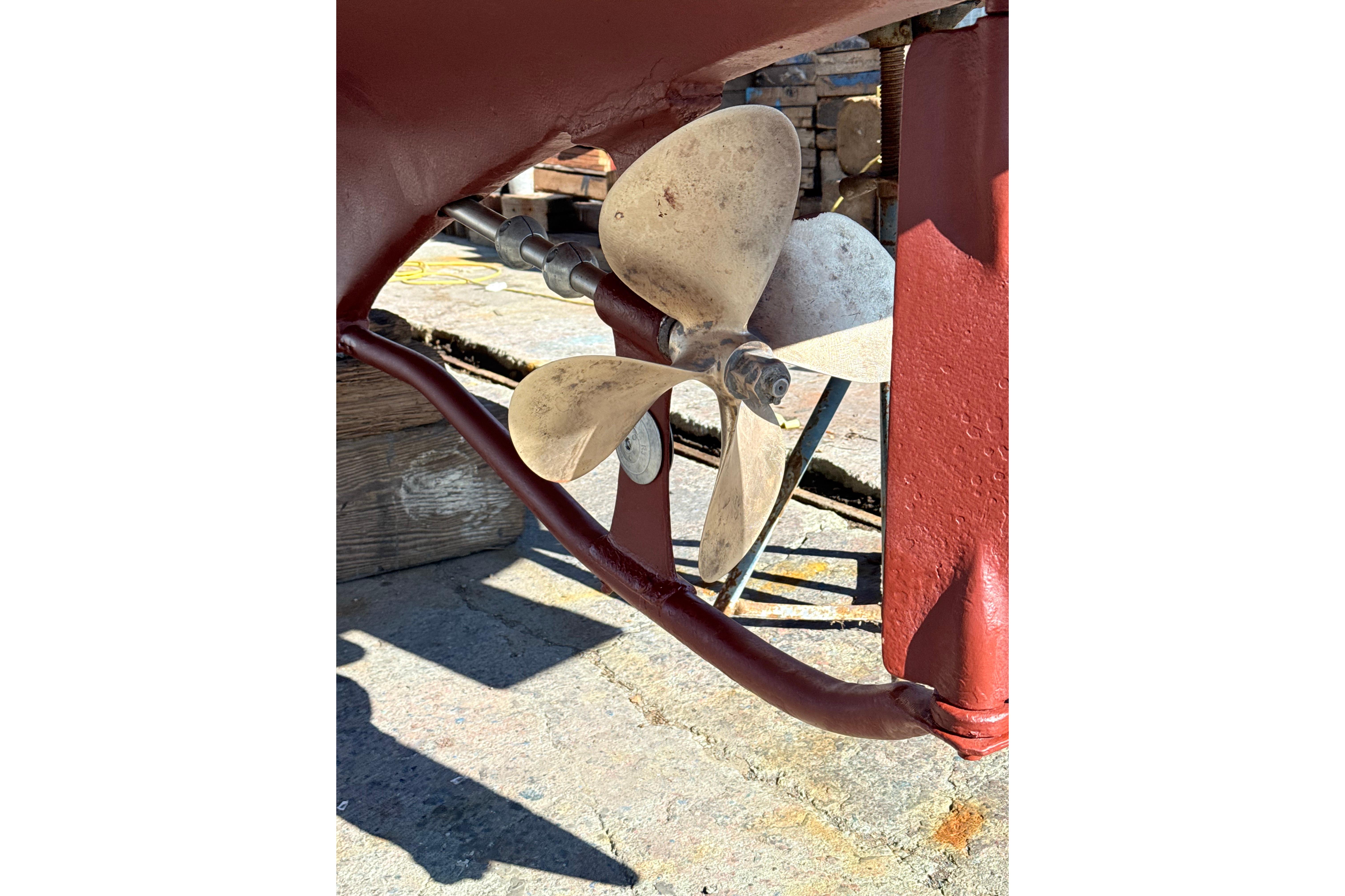 Propeller of a 1974 Dyer 29' Sport Fisher boat on dry dock.