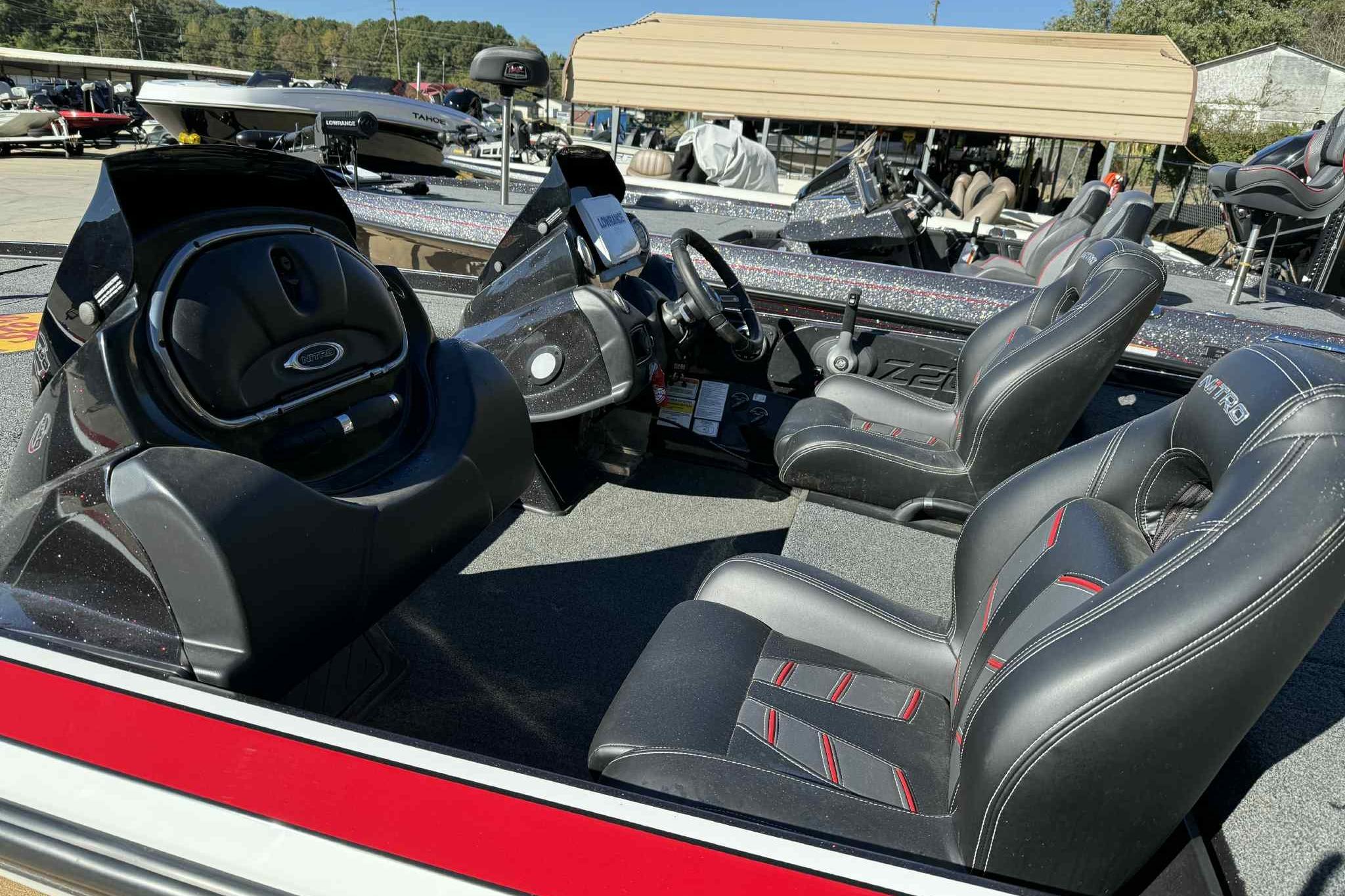 Interior of a 2017 Nitro Z20 Pro boat with black and red seating.