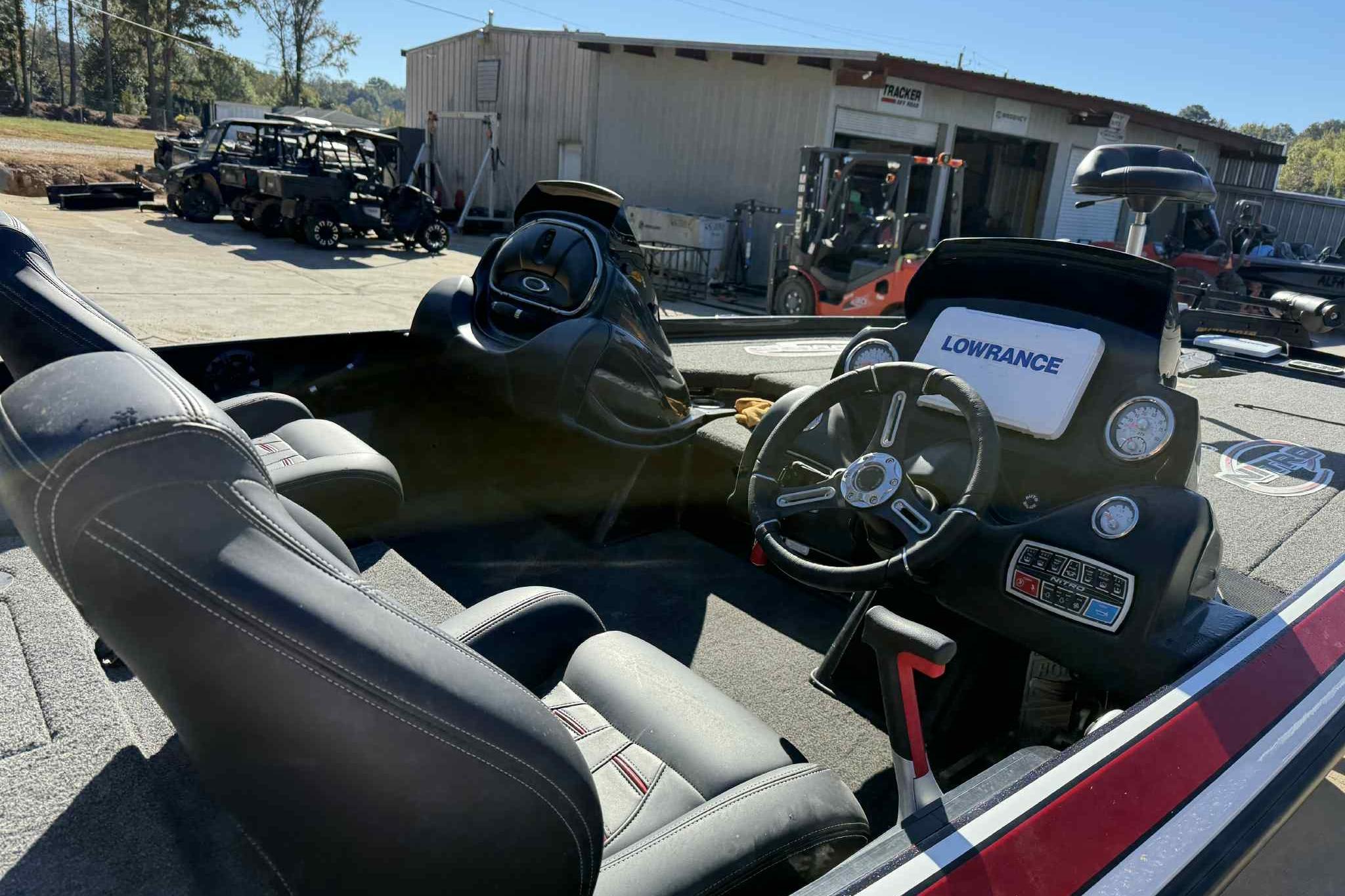 Interior of a 2017 Nitro Z20 Pro boat with Lowrance electronics and steering wheel.