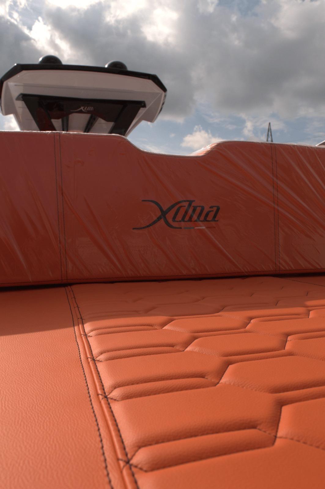 DNA-46 2026 -FL-US-Orange leather seating on a 2025 DNA 46 boat under a cloudy sky.-9703461 | Thumbnail