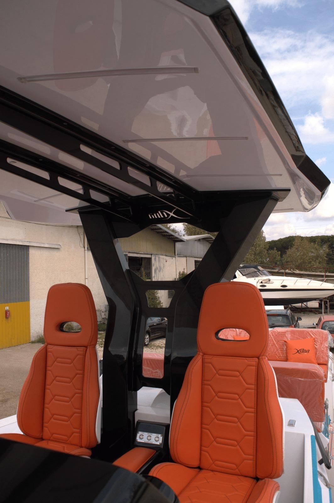 DNA-46 2026 -FL-US-Orange seats on a DNA 46 boat, 2025 model, with sleek black frame and canopy.-9703461 | Thumbnail