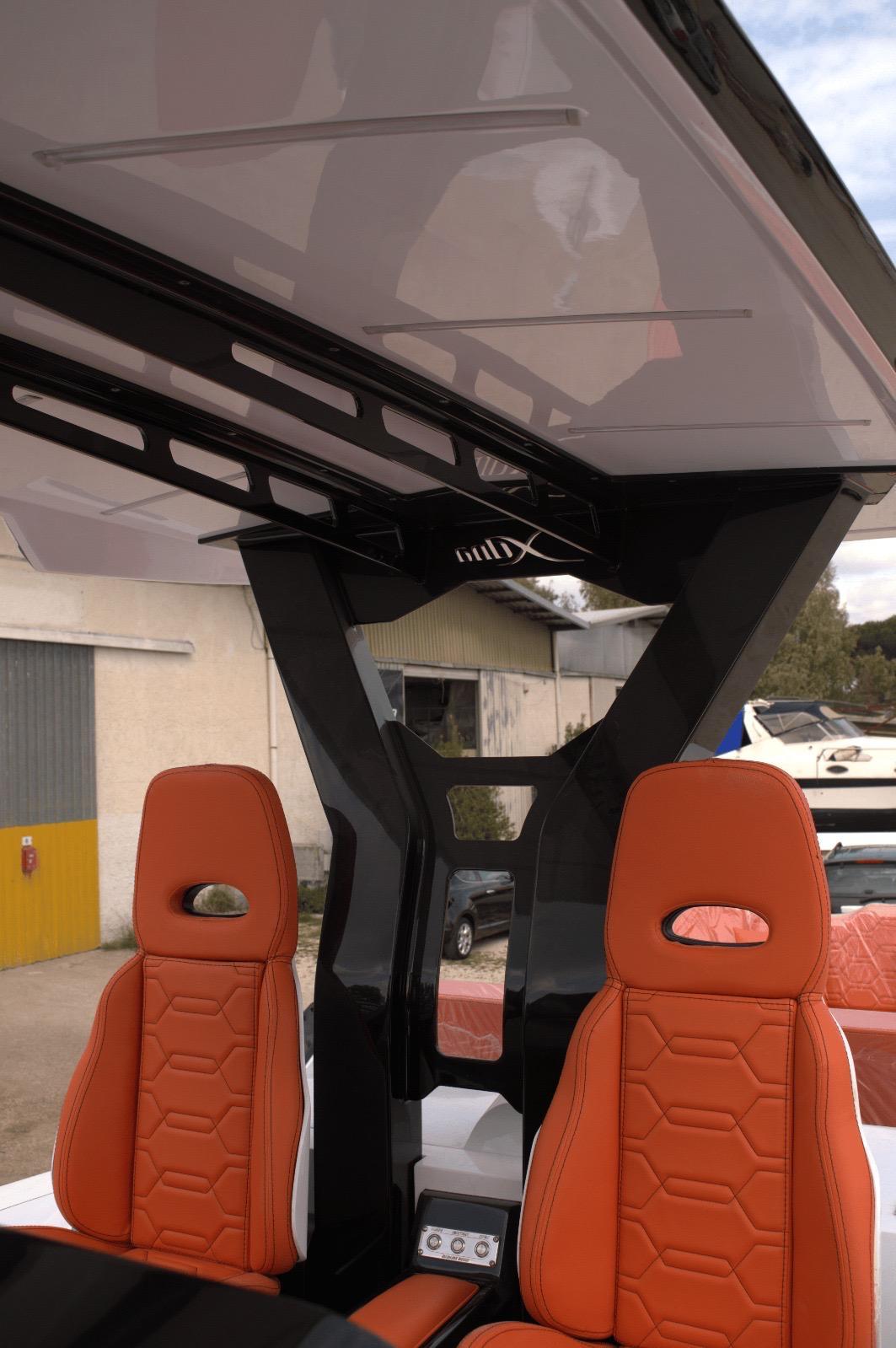 DNA-46 2026 -FL-US-2025 DNA 46 boat interior with orange seats and modern design elements.-9703461 | Thumbnail