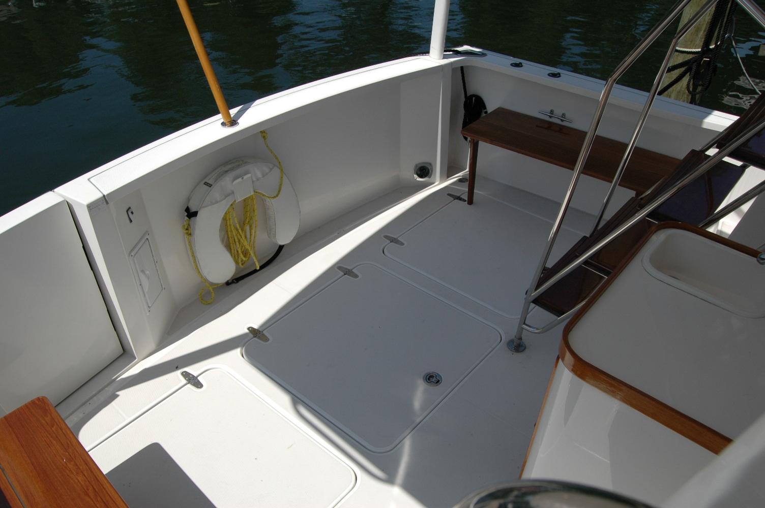 2006 Sabre 36 Flybridge Sedan deck with life preserver and seating area.