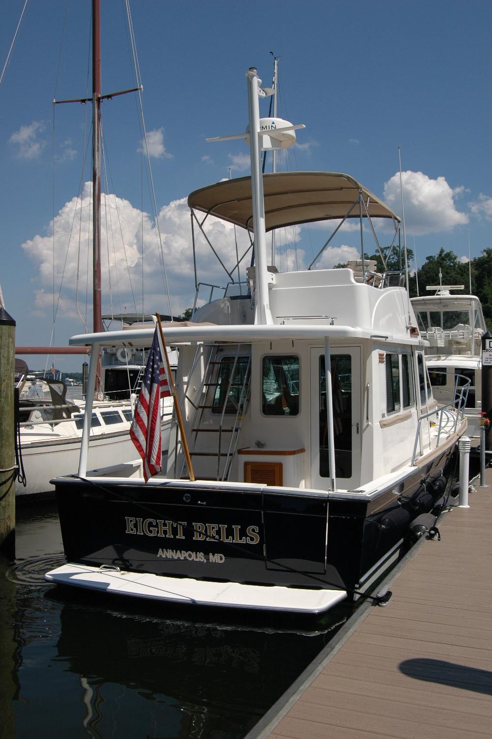 2006 Sabre 36 Flybridge Sedan docked, displaying American flag, Annapolis, MD.