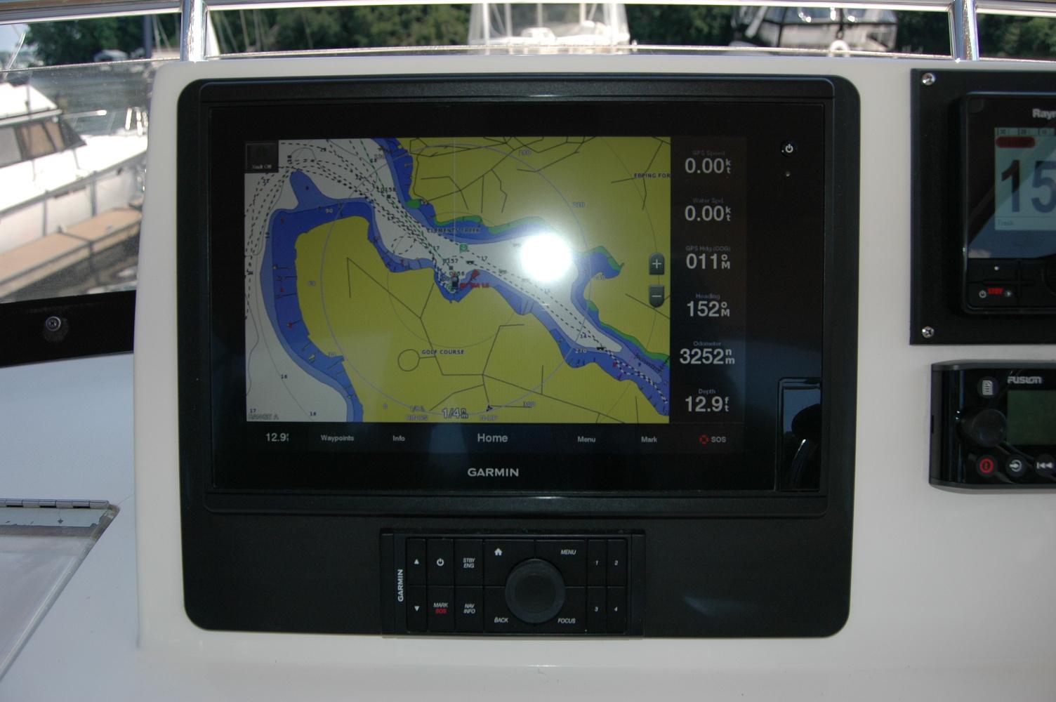 Garmin navigation display on 2006 Sabre 36 Flybridge Sedan boat dashboard.