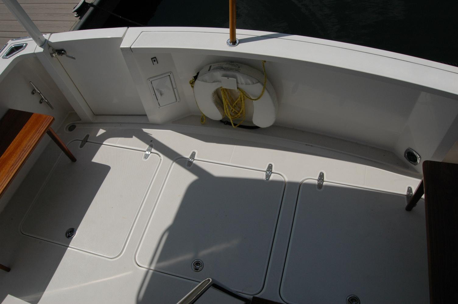 2006 Sabre 36 Flybridge Sedan deck with storage hatches and life preserver.