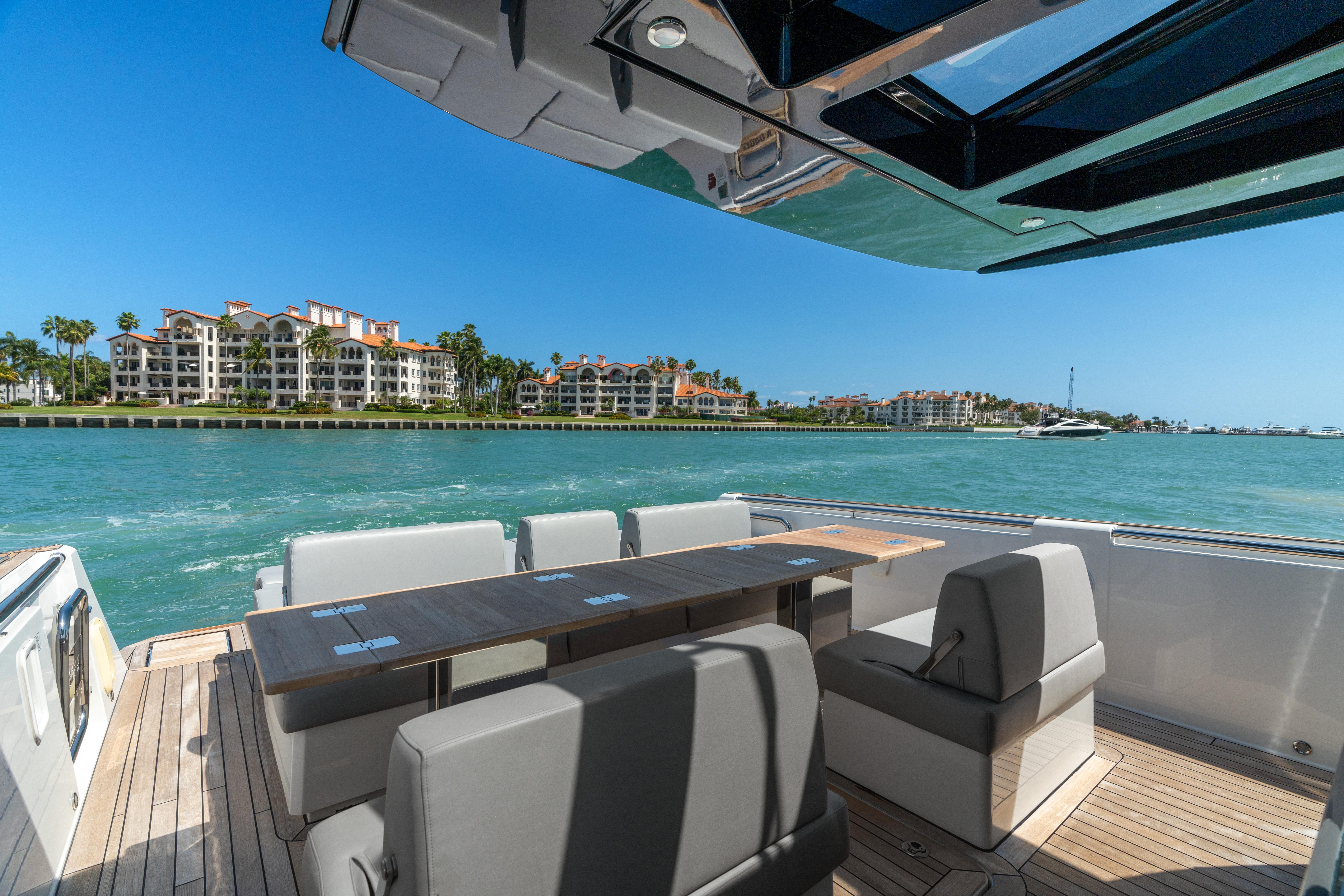 Fjord-44 Open 2022-HINJUICE FL-US-Luxurious 2022 Fjord 44 Open yacht with spacious seating, cruising near waterfront properties.-9860902 | Thumbnail