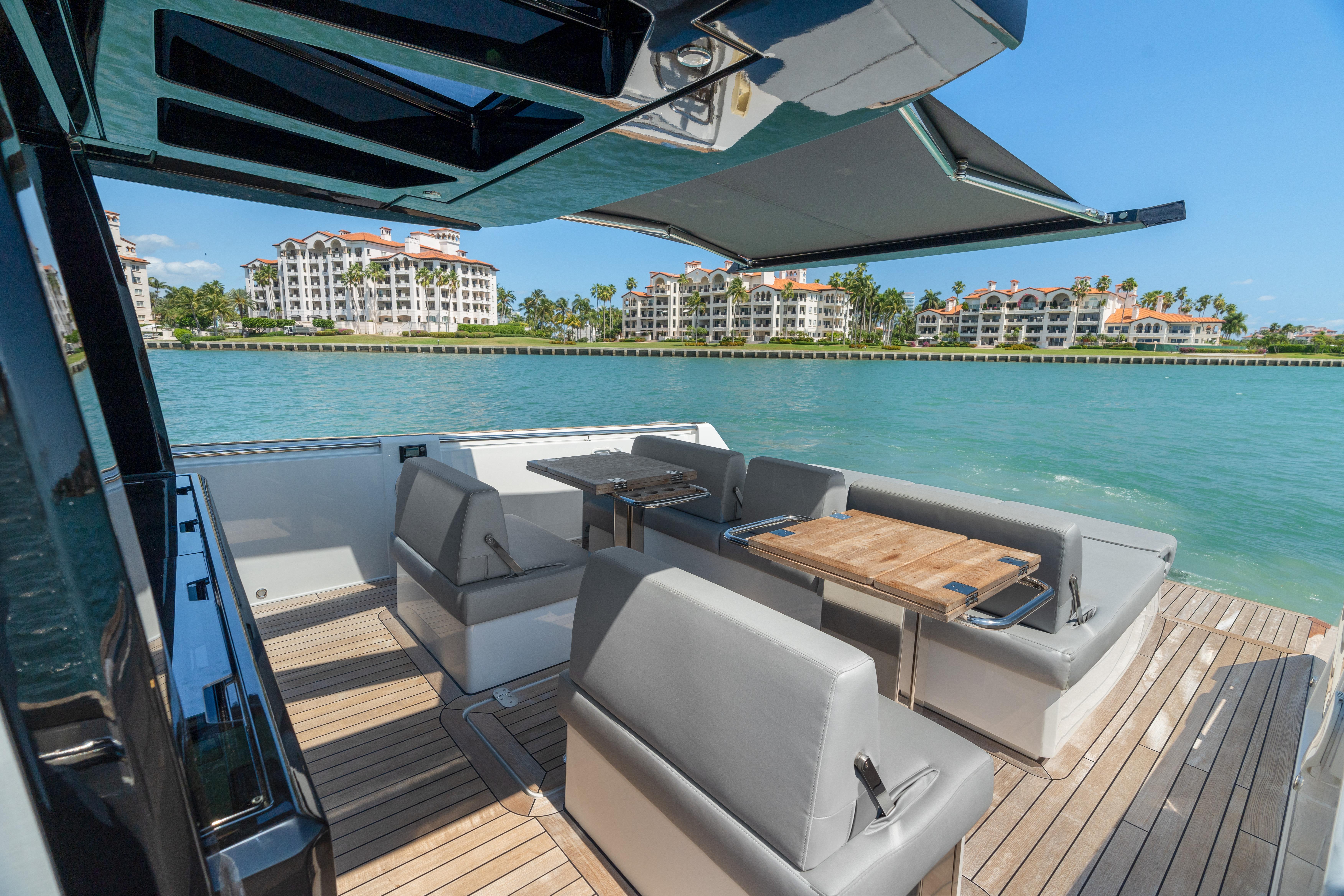 Fjord-44 Open 2022-HINJUICE FL-US-Luxurious 2022 Fjord 44 Open yacht with elegant seating, docked near waterfront condos.-9860902 | Thumbnail