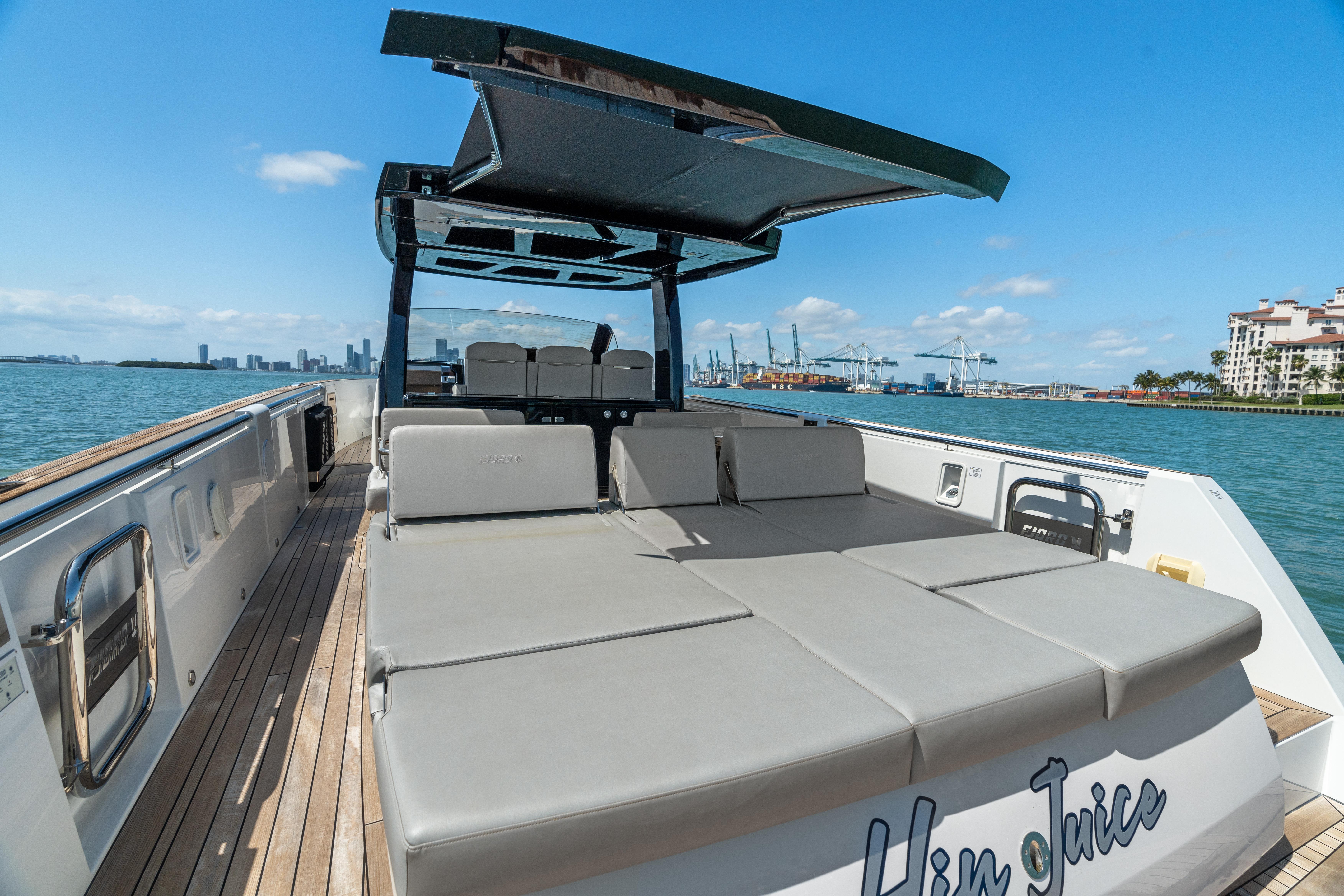 Fjord-44 Open 2022-HINJUICE FL-US-2022 Fjord 44 Open yacht with spacious deck and sunbathing area, docked by the waterfront.-9860902 | Thumbnail