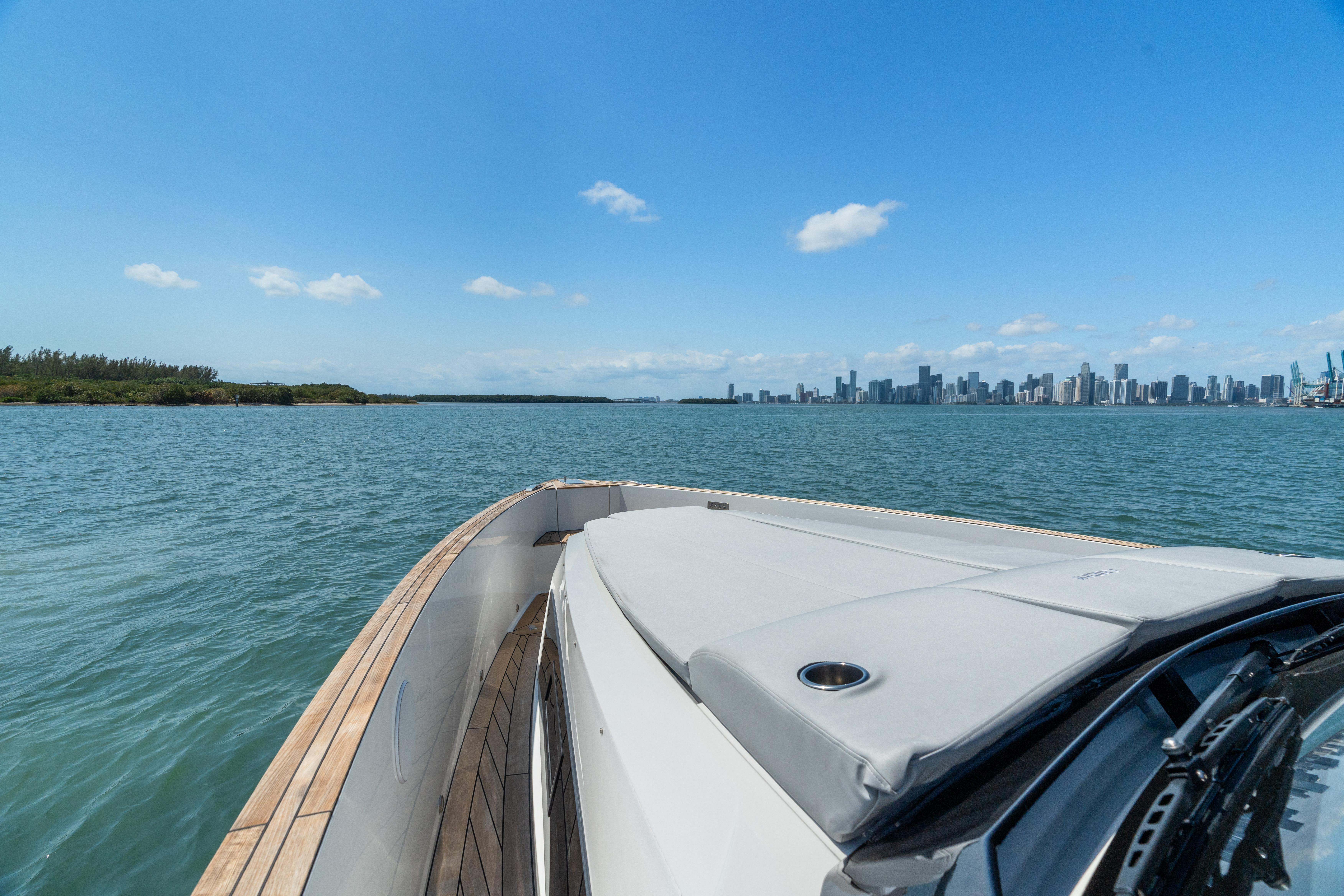 Fjord-44 Open 2022-HINJUICE FL-US-2022 Fjord 44 Open yacht cruising with city skyline in the background.-9860902 | Thumbnail