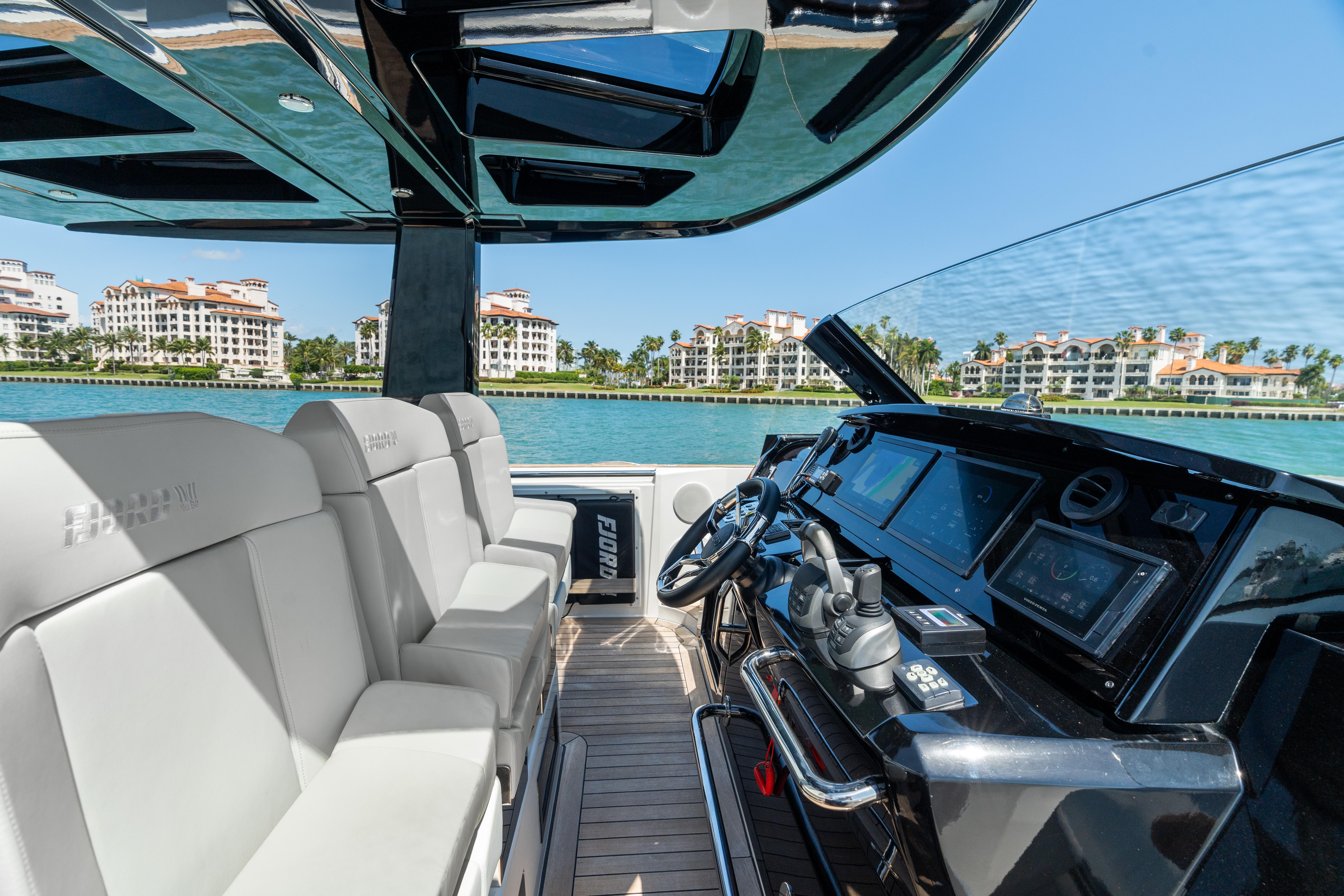 Fjord-44 Open 2022-HINJUICE FL-US-2022 Fjord 44 Open yacht interior with modern helm and luxurious seating.-9860902 | Thumbnail