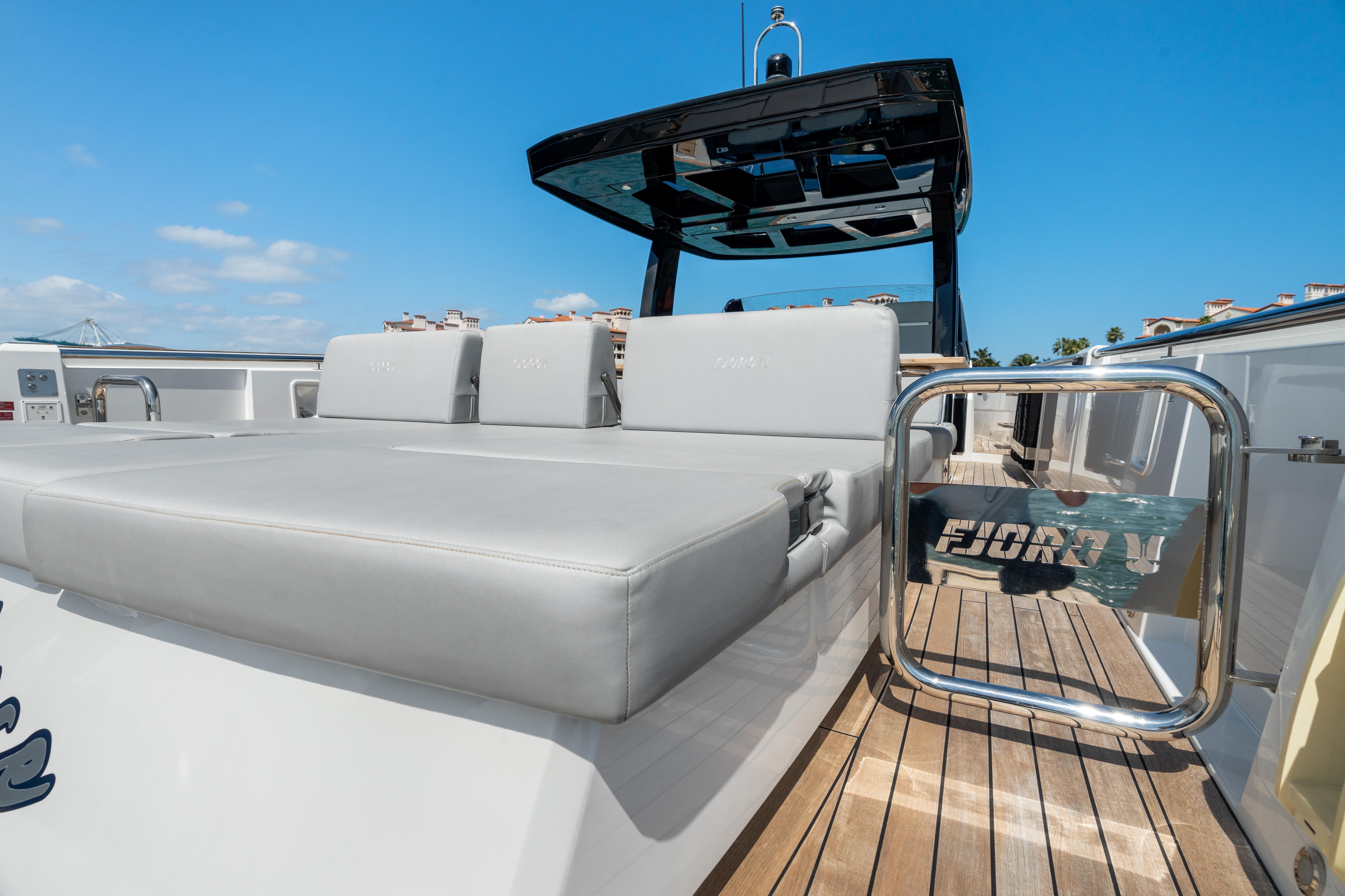 Fjord-44 Open 2022-HINJUICE FL-US-2022 Fjord 44 Open yacht with sleek deck and luxurious seating under clear blue sky.-9860902 | Thumbnail