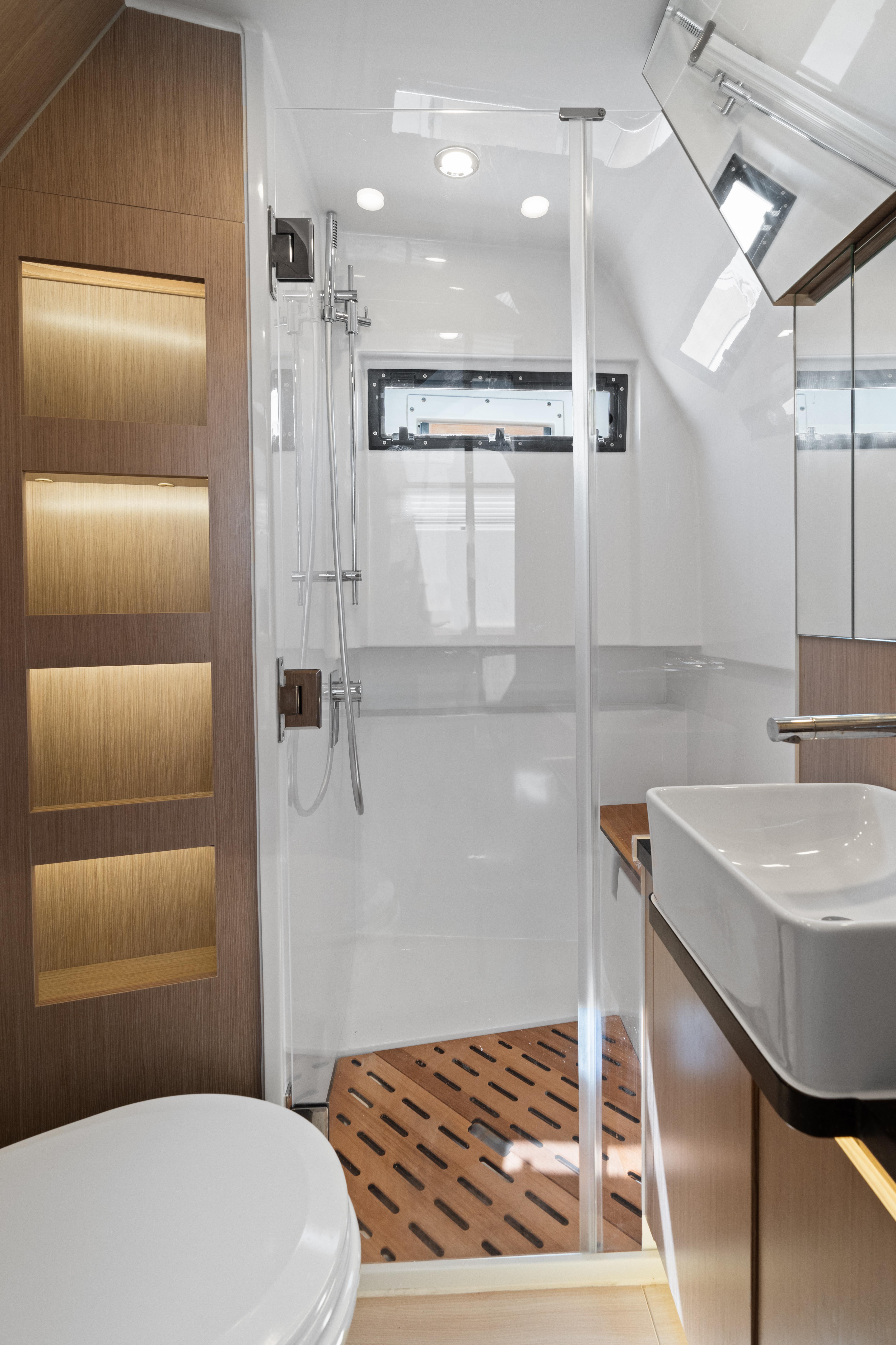 Fjord-44 Open 2022-HINJUICE FL-US-Modern bathroom interior of 2022 Fjord 44 Open yacht, featuring sleek design and wooden accents.-9860902 | Thumbnail
