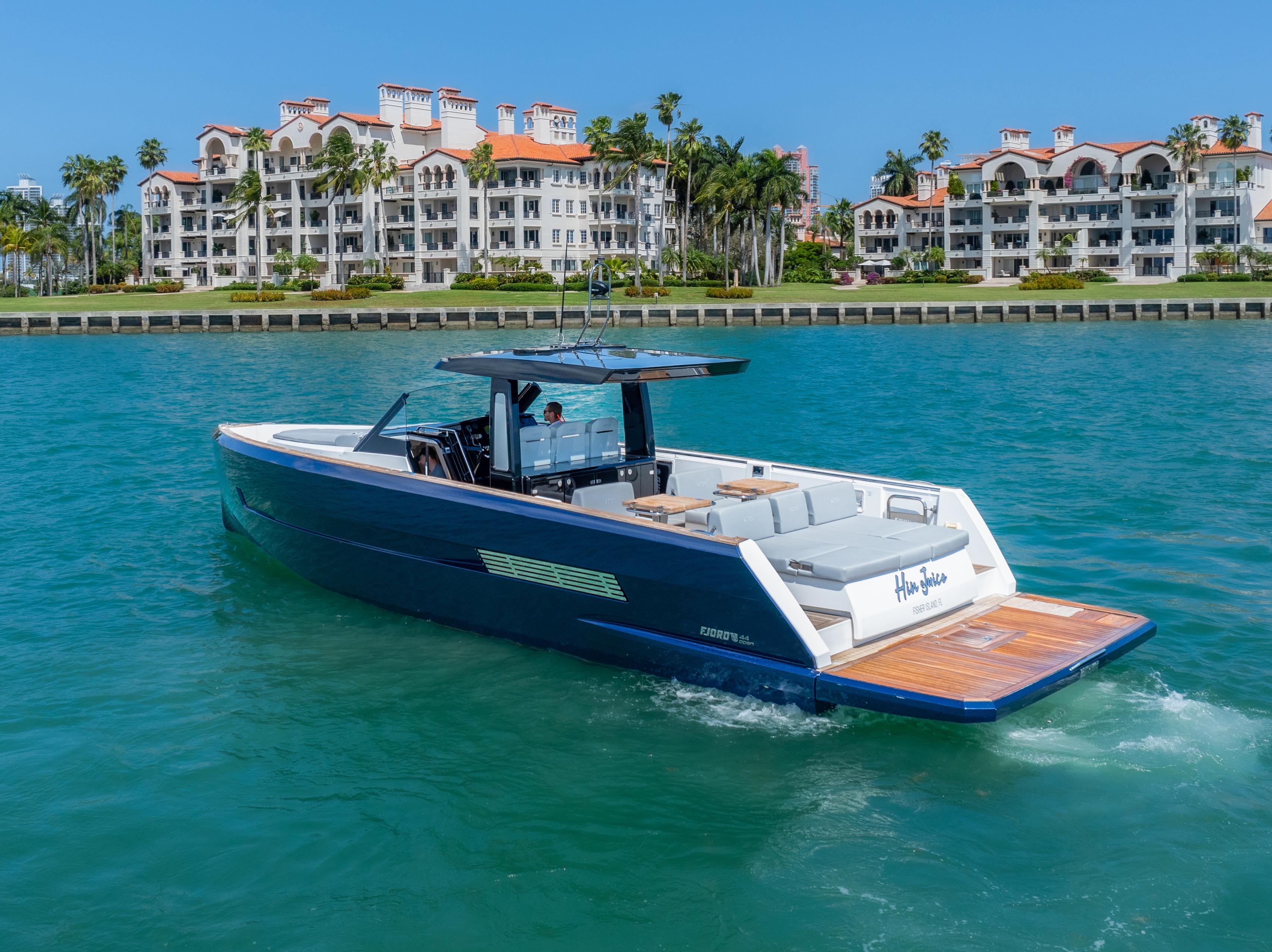 Fjord-44 Open 2022-HINJUICE FL-US-2022 Fjord 44 Open yacht cruising near luxury waterfront residences.-9860902 | Thumbnail