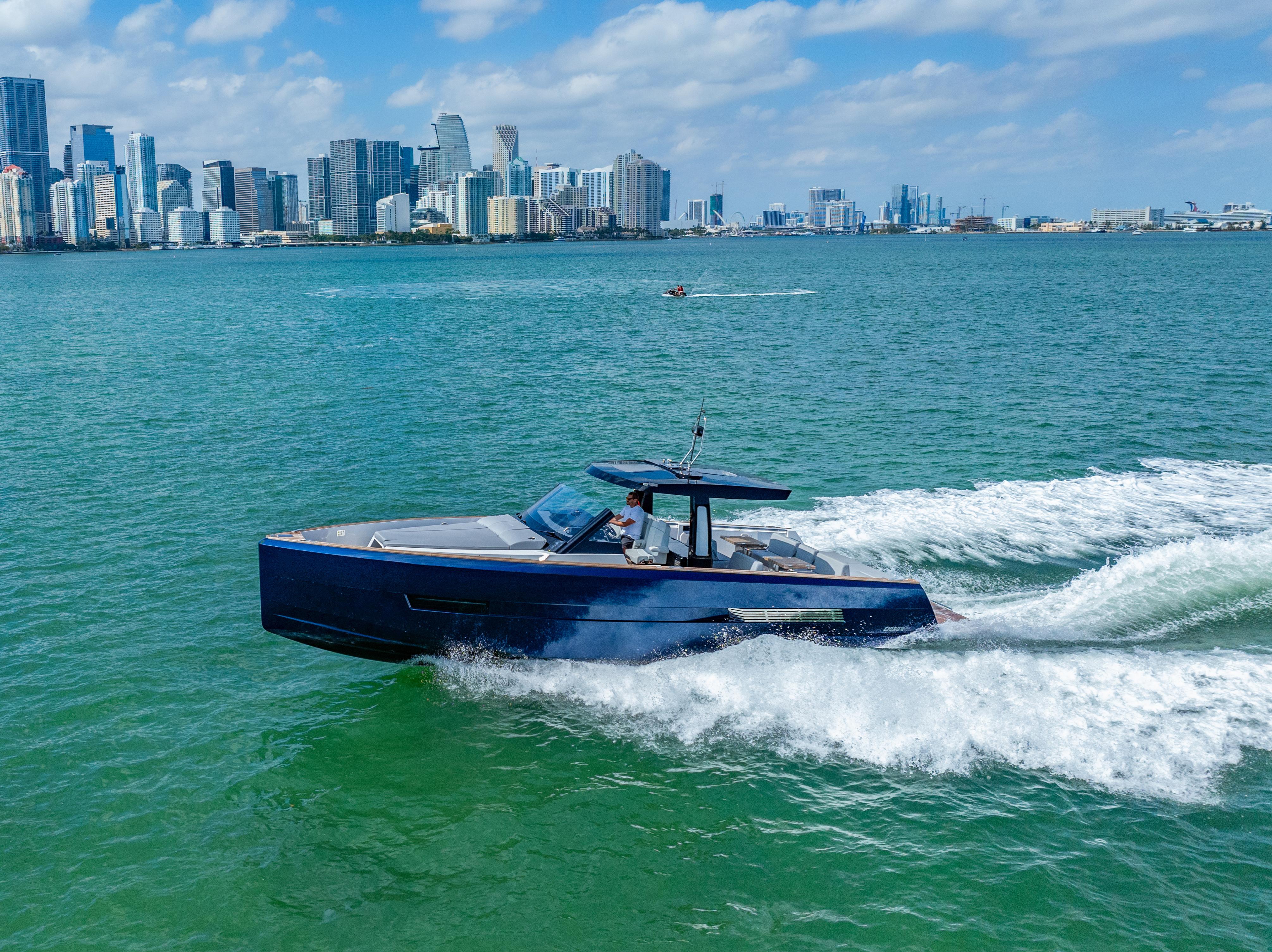 Fjord-44 Open 2022-HINJUICE FL-US-2022 Fjord 44 Open yacht cruising in a city harbor with skyline backdrop.-9860902 | Thumbnail