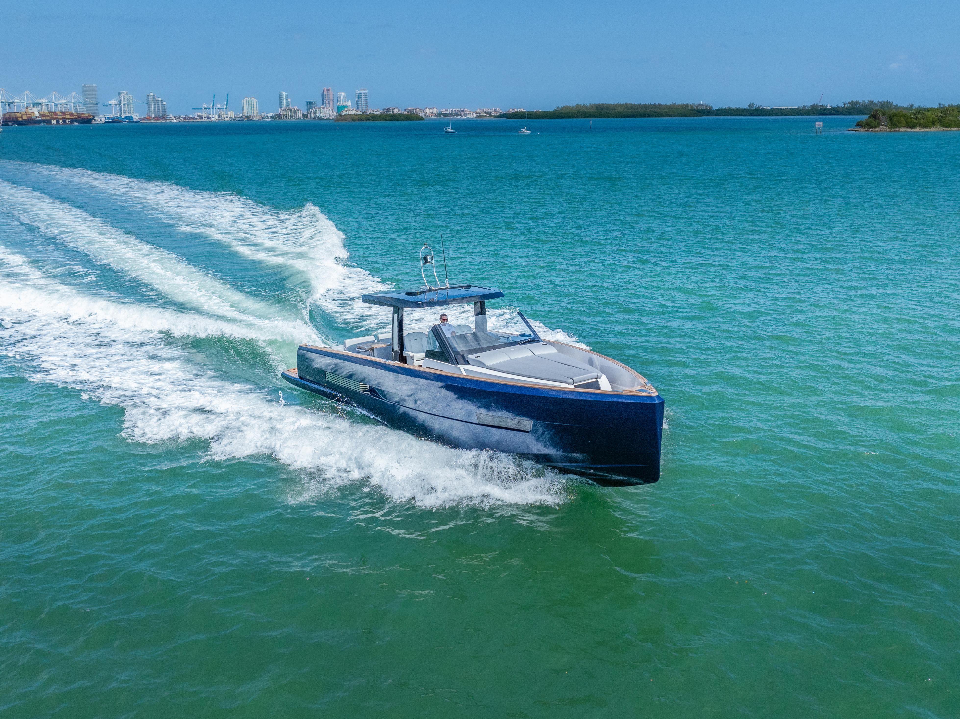 Fjord-44 Open 2022-HINJUICE FL-US-2022 Fjord 44 Open yacht cruising on blue ocean near city skyline.-9860902 | Thumbnail