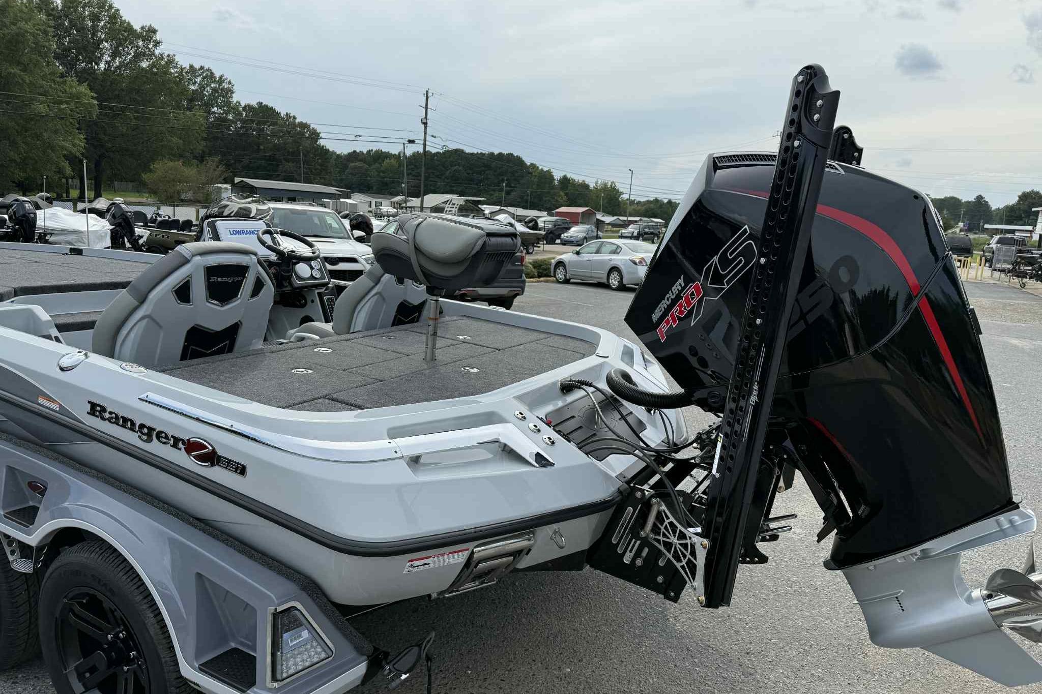 2026 Ranger Z521 boat with Mercury Pro XS engine in a parking lot.