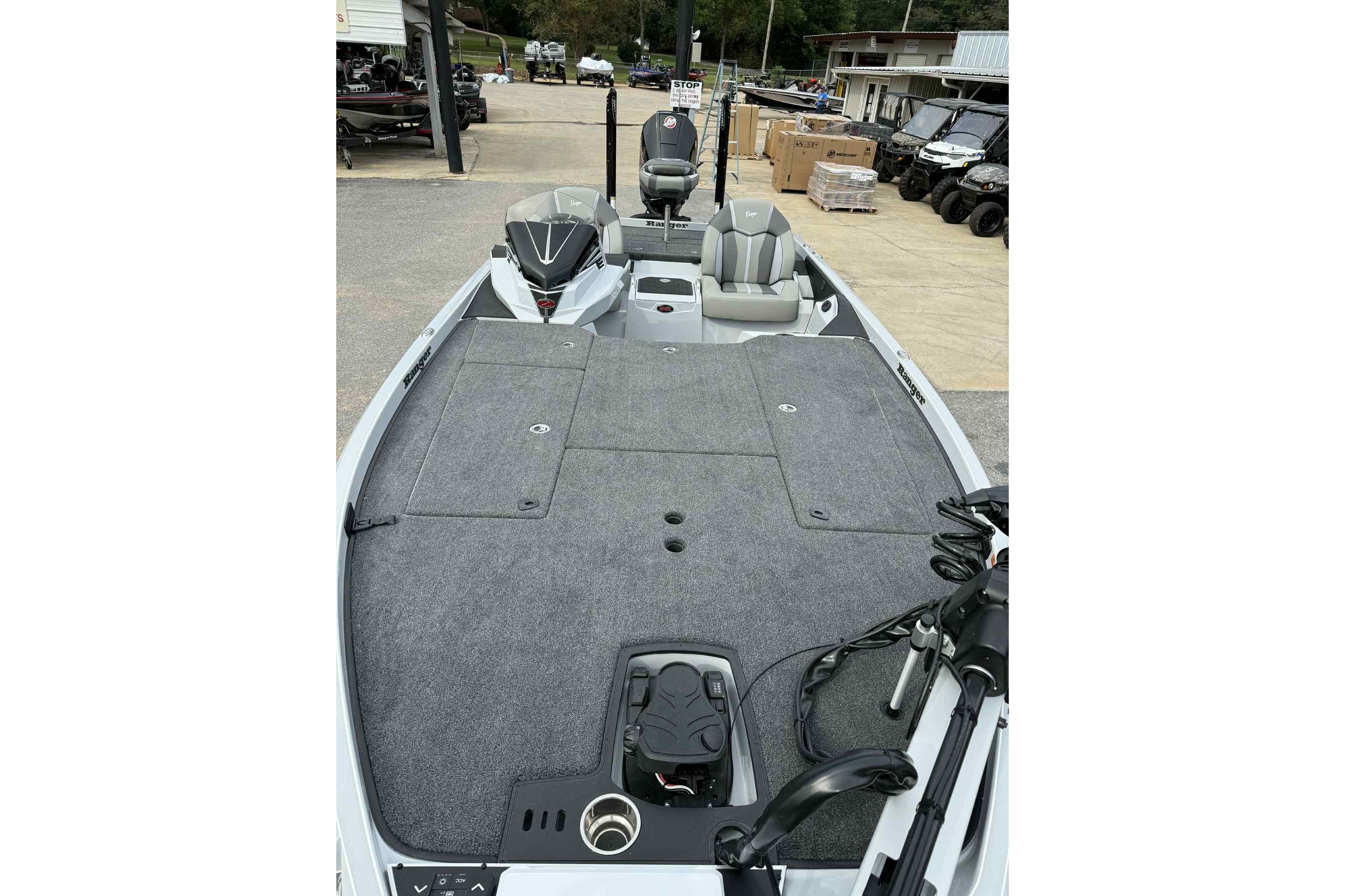2026 Ranger Z521 boat with spacious deck and modern seating in a showroom.