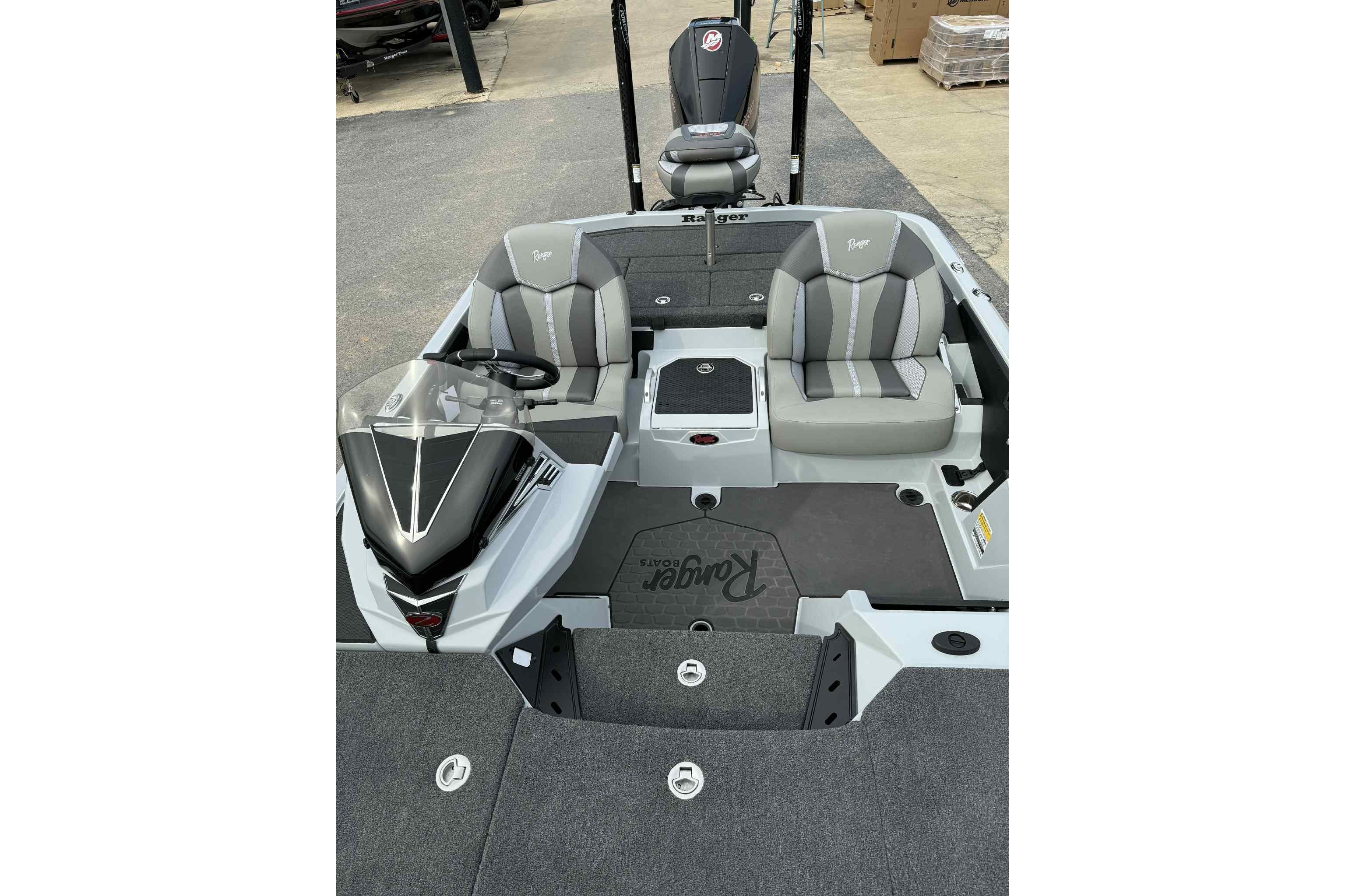 2026 Ranger Z521 boat interior with gray seating and steering console.
