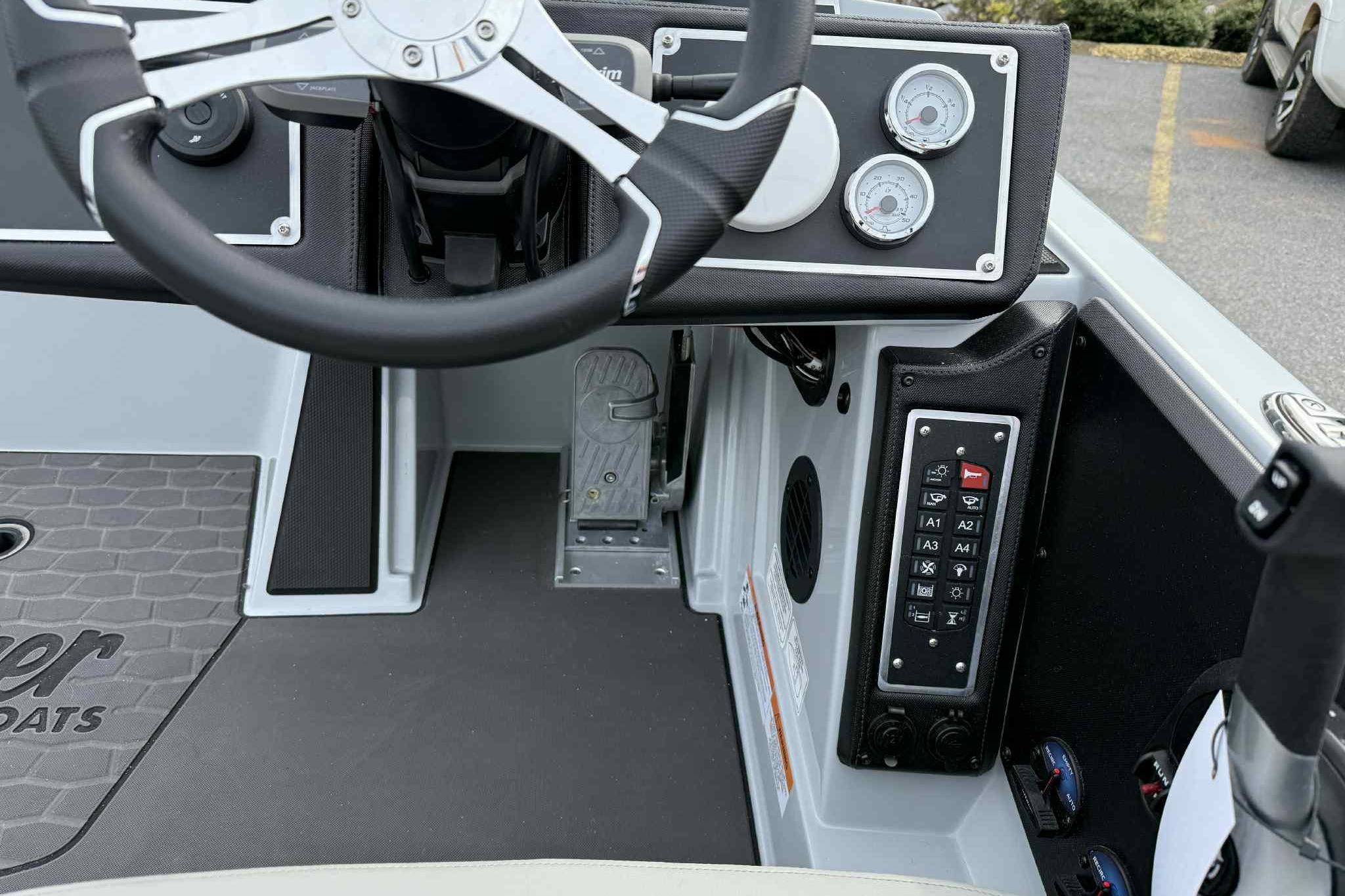2026 Ranger Z521 boat dashboard with steering wheel, gauges, and control panel.