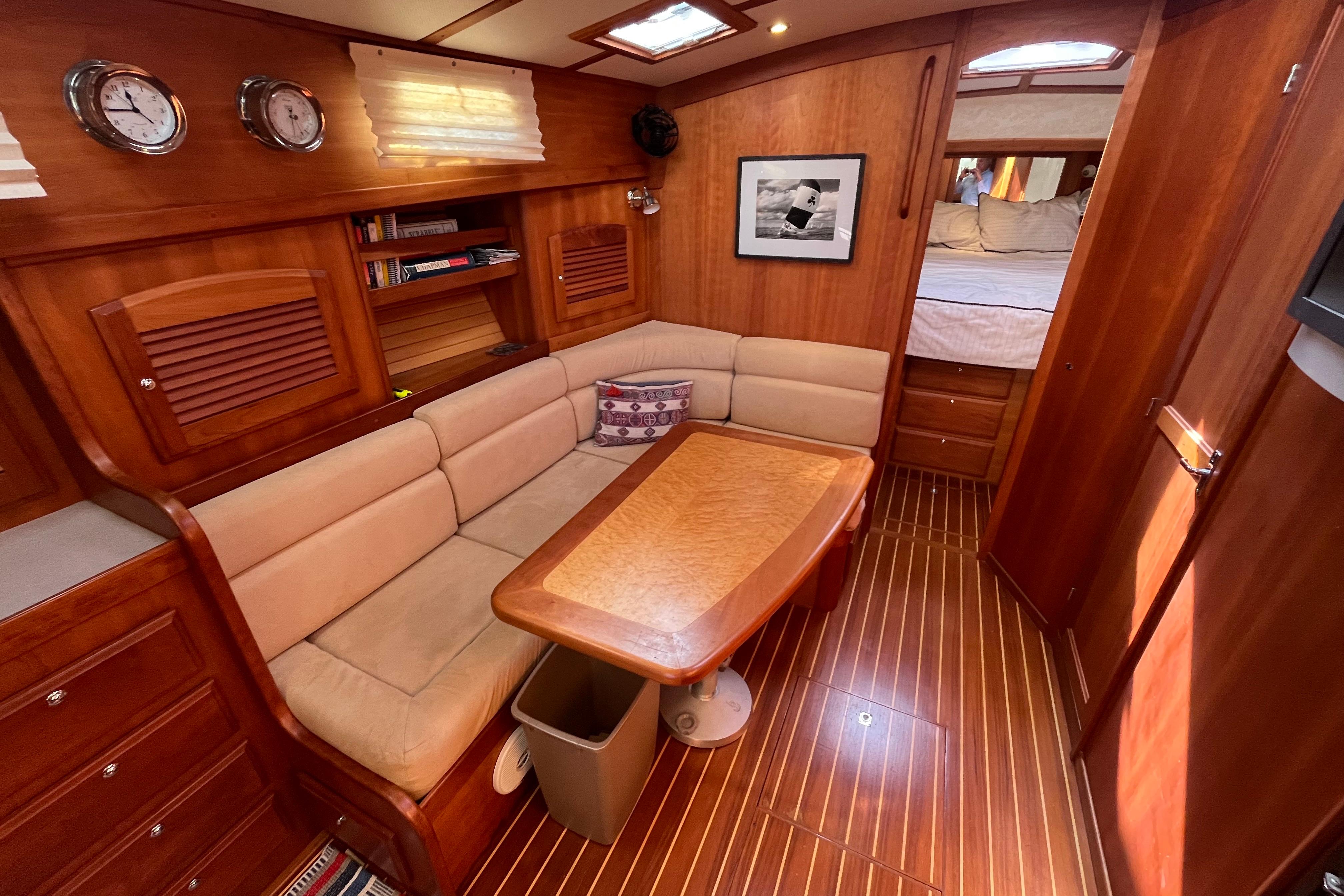 Luxurious interior of 2004 Sabre 42 Hardtop Express yacht with wood finish and cozy seating.