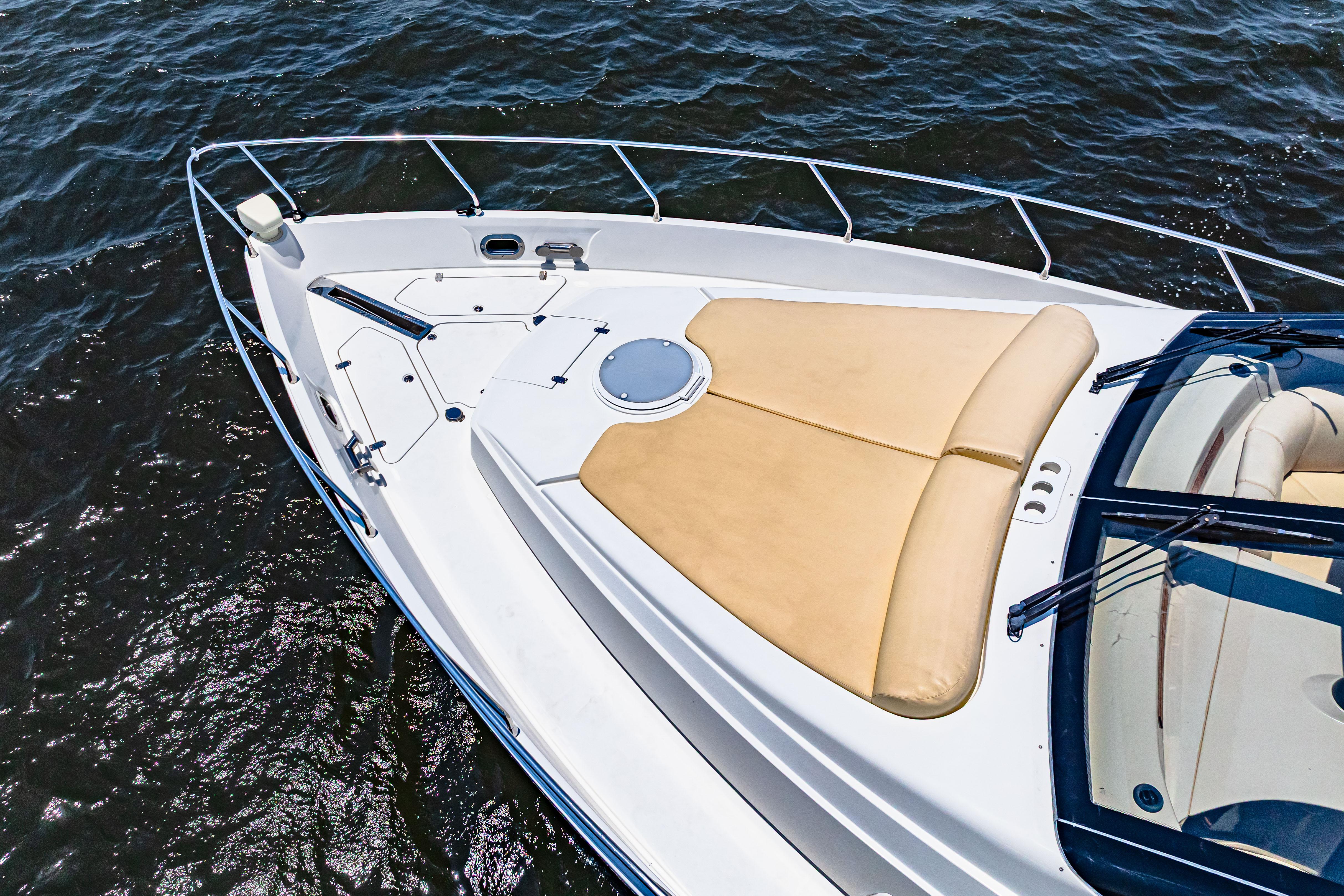 Marquis-59 2005-Victory FL-US-2005 Marquis 59 yacht bow with sunpad on water.-9773566 | Thumbnail