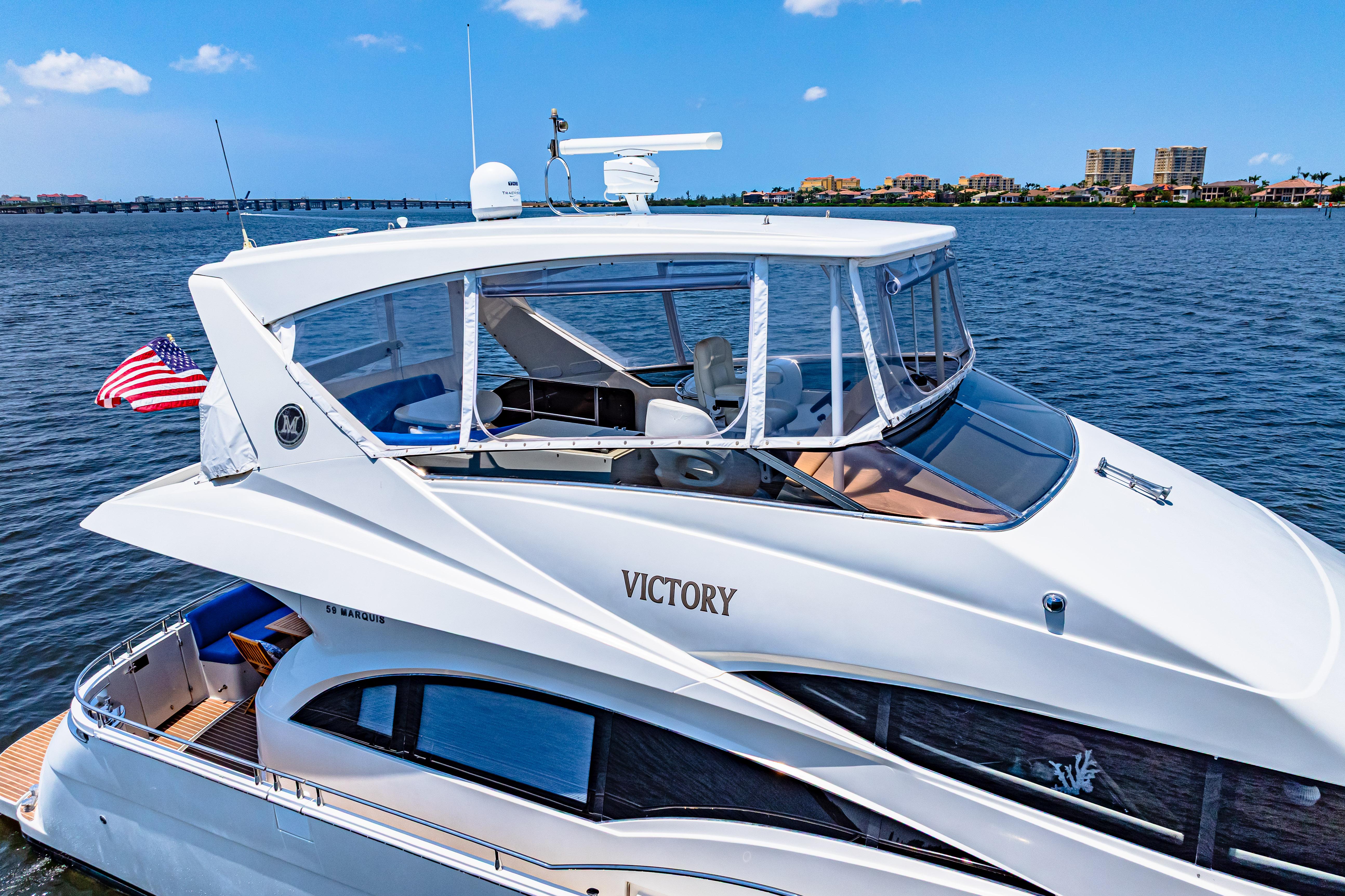 Marquis-59 2005-Victory FL-US-Luxurious 2005 Marquis 59 yacht named Victory cruising on a serene blue waterway.-9773566 | Thumbnail