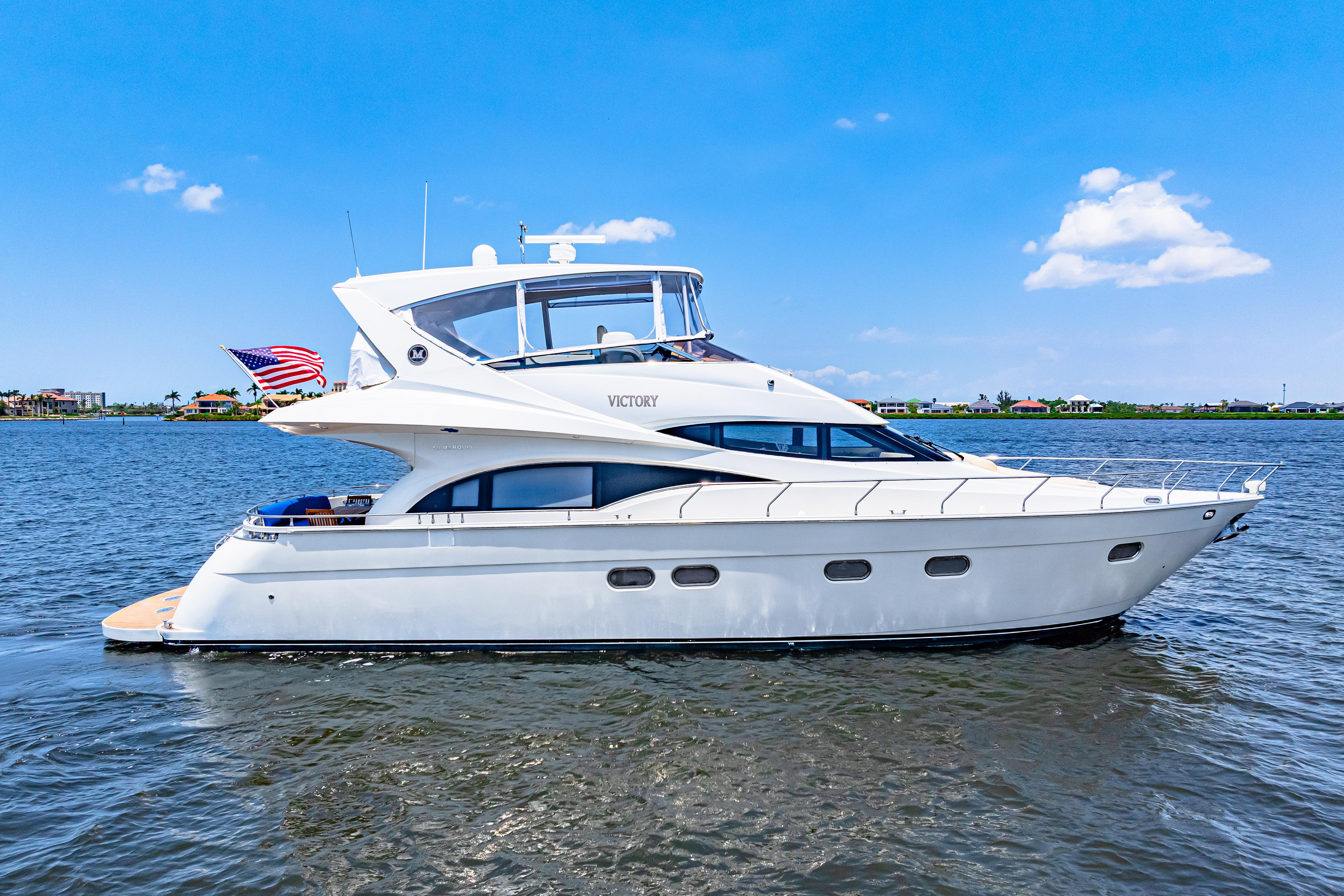 Marquis-59 2005-Victory FL-US-Luxury 2005 Marquis 59 yacht cruising on a sunny day with clear blue skies.-9773566 | Thumbnail