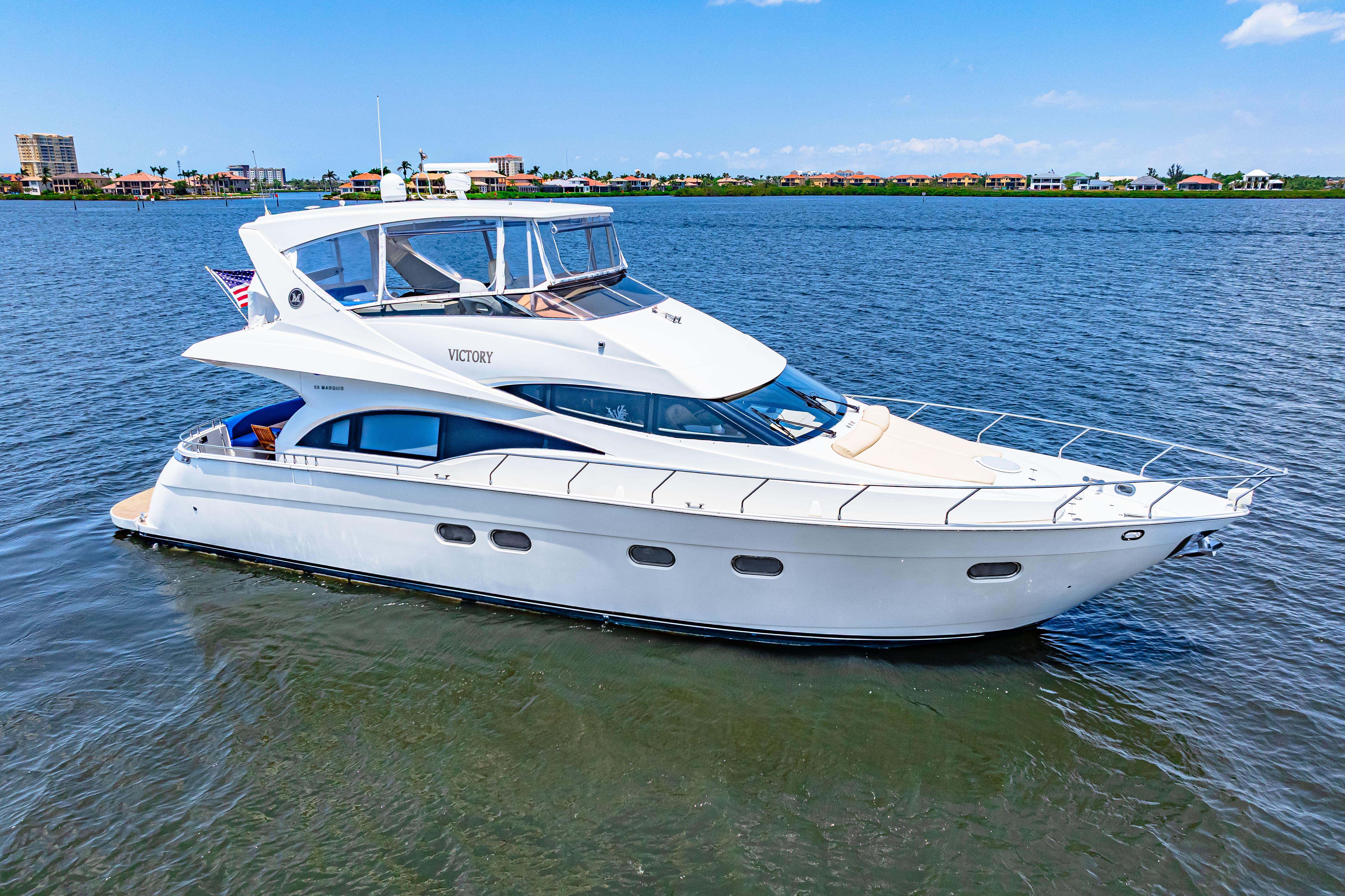 Marquis-59 2005-Victory FL-US-Luxury 2005 Marquis 59 yacht cruising on a serene blue waterway.-9773566 | Thumbnail