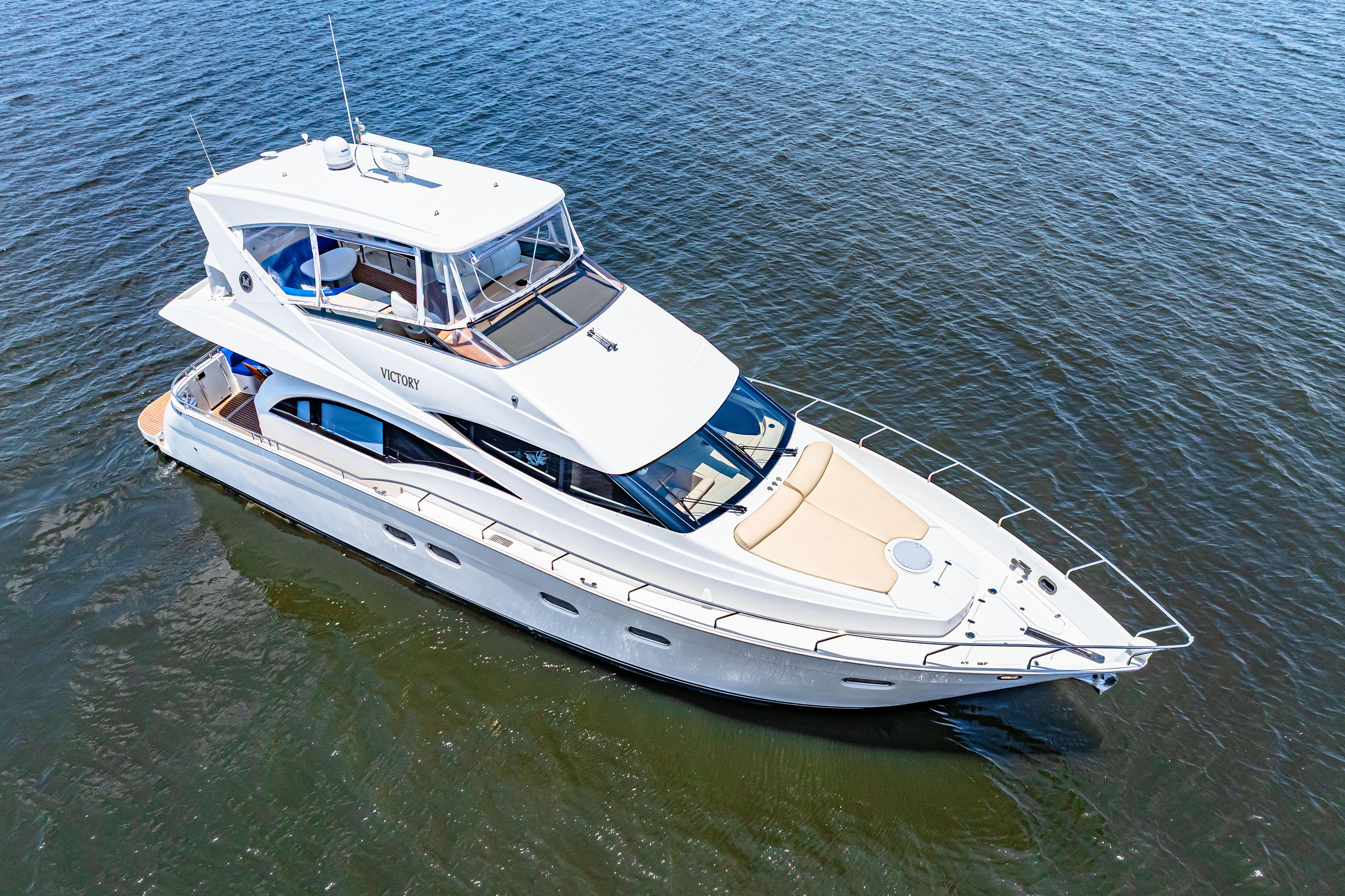 Marquis-59 2005-Victory FL-US-2005 Marquis 59 yacht cruising on open water, aerial view.-9773566 | Thumbnail