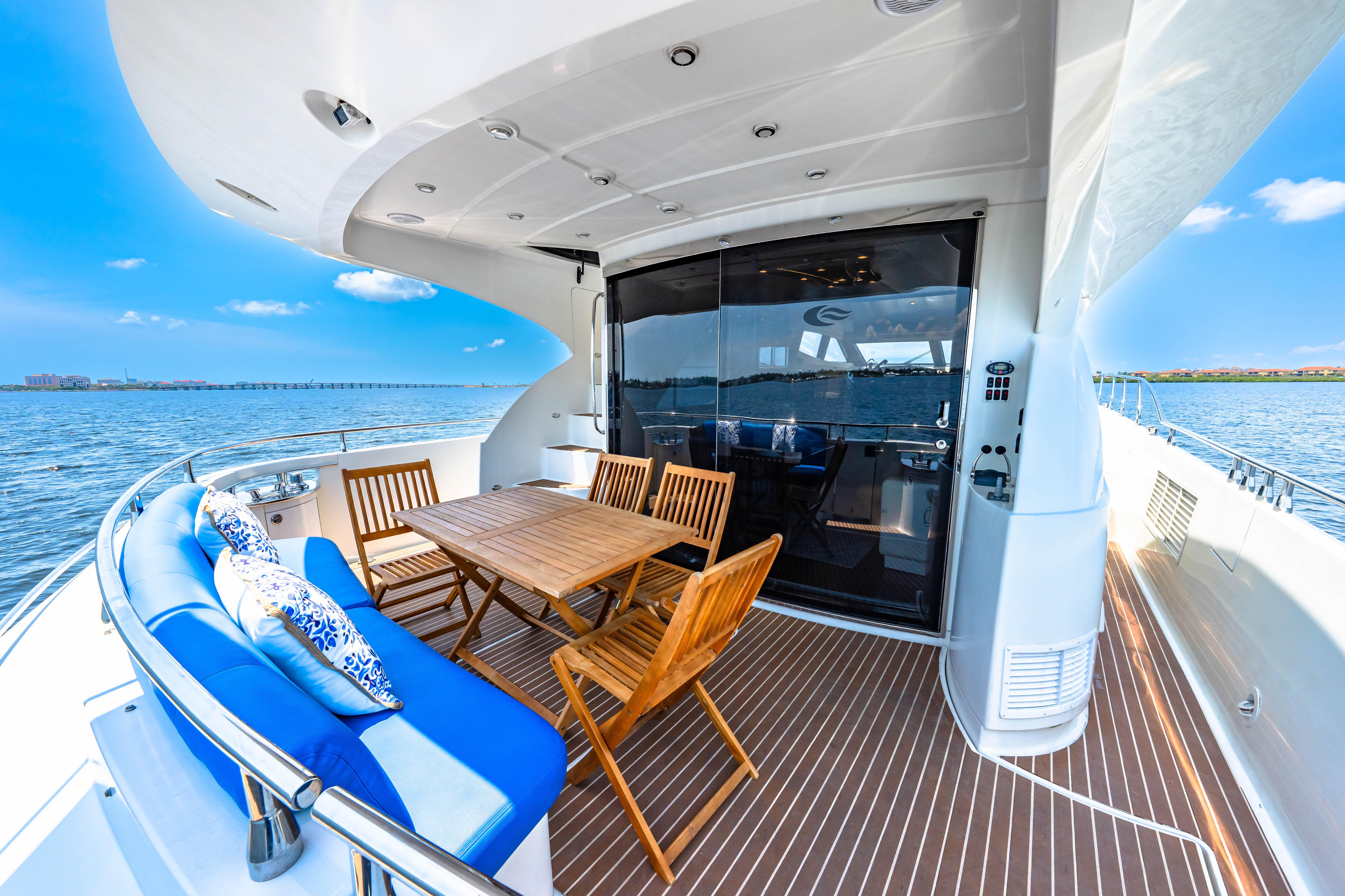 Marquis-59 2005-Victory FL-US-Luxurious 2005 Marquis 59 yacht deck with seating, table, and ocean view.-9773566 | Thumbnail