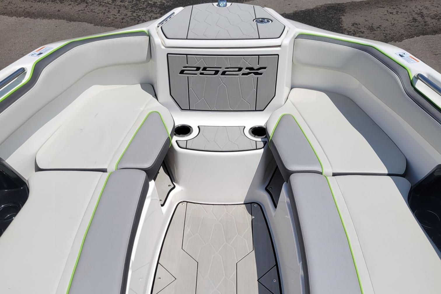2021 Yamaha Boats 252XE interior with gray seating and green accents.